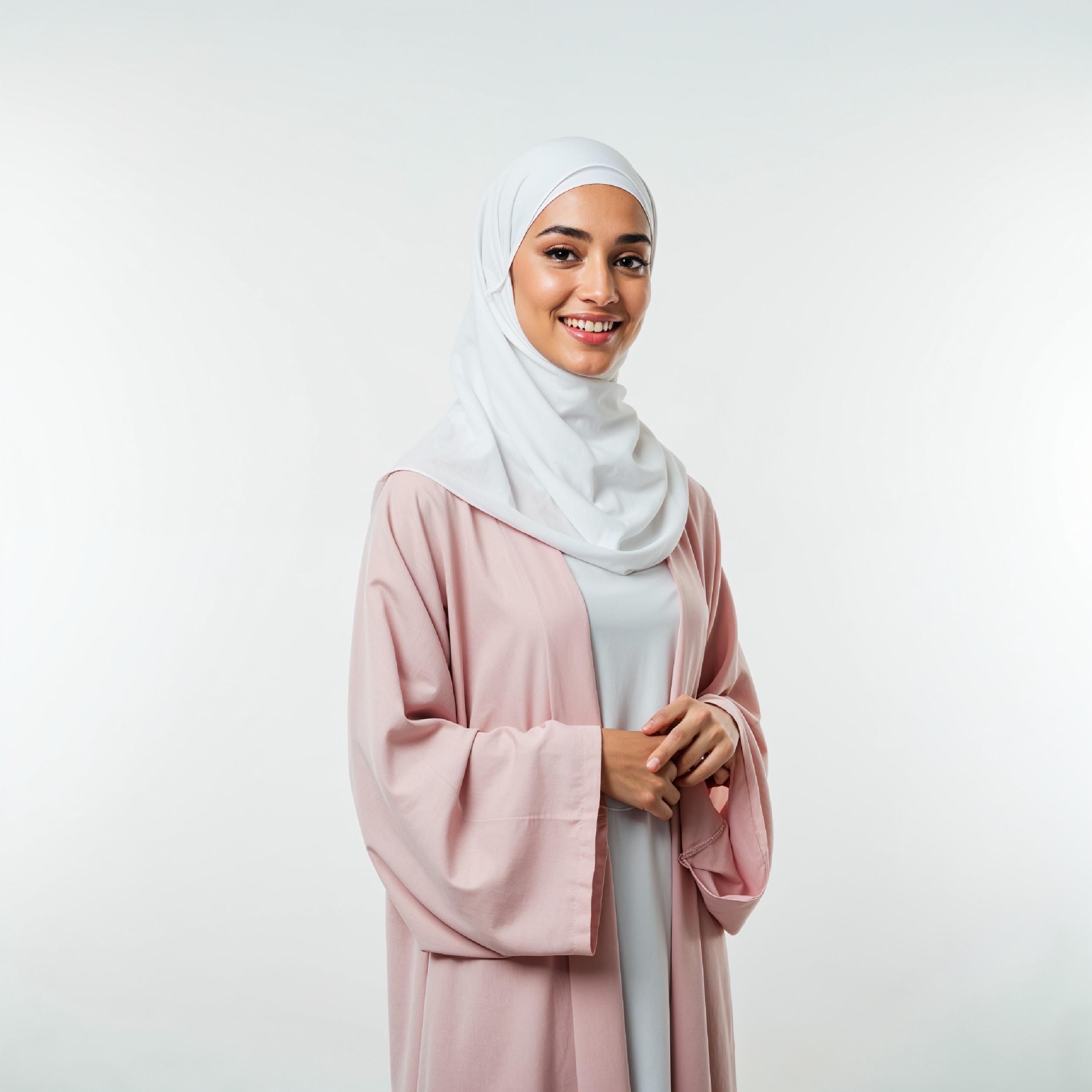 Beautiful Young Muslim Woman Wearing White Hijab and Modest Dress in Studio Portrait