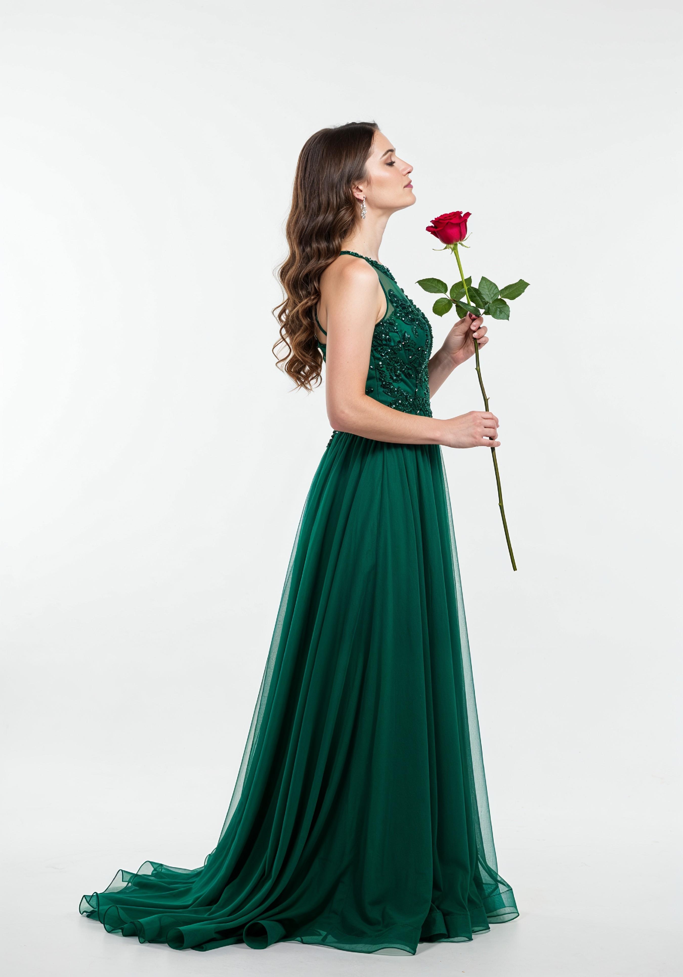Beautiful Young Woman Holding Red Rose in Elegant Dress Romantic Portrait