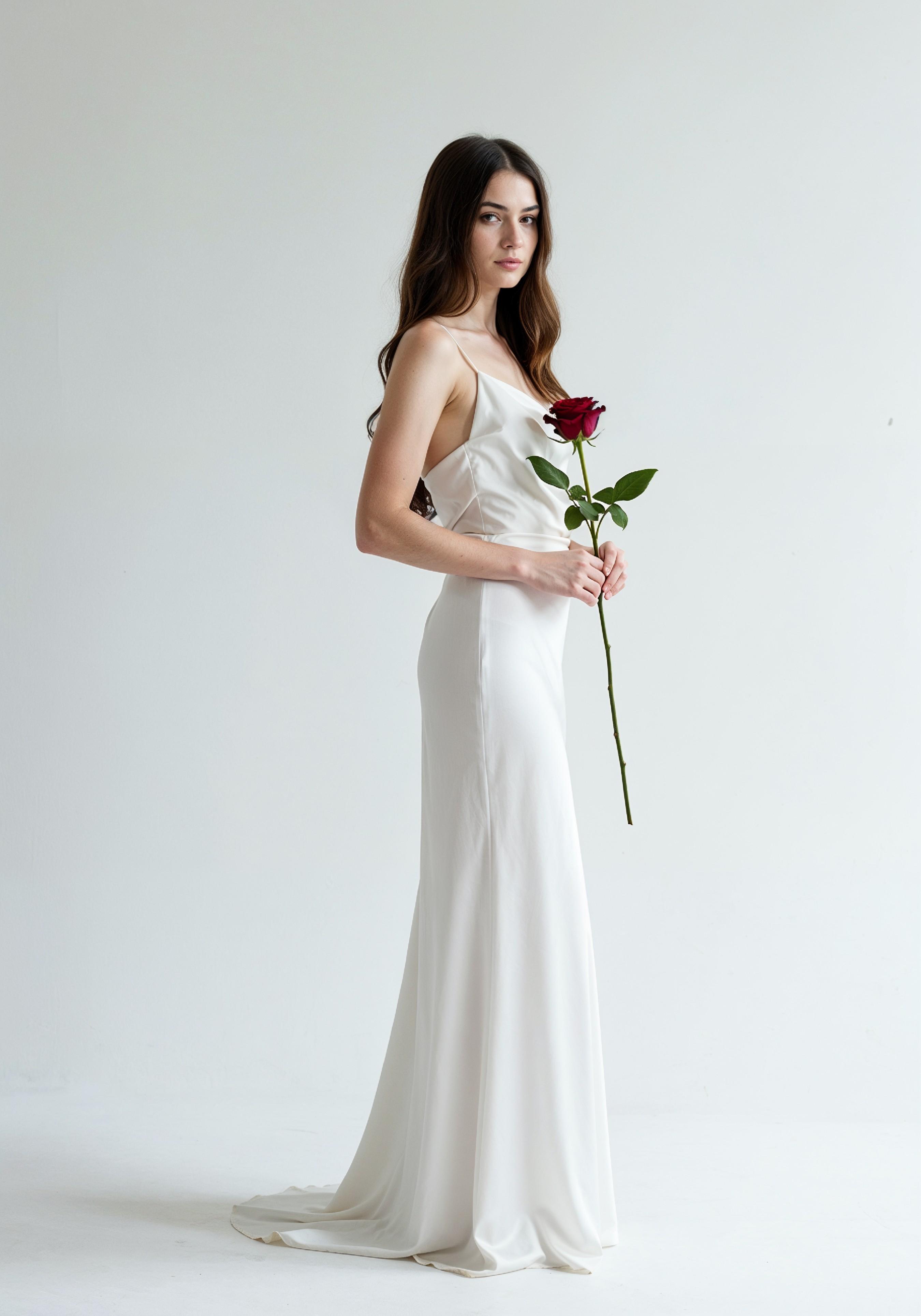 Beautiful Young Woman Holding Red Rose in Elegant Dress Romantic Portrait