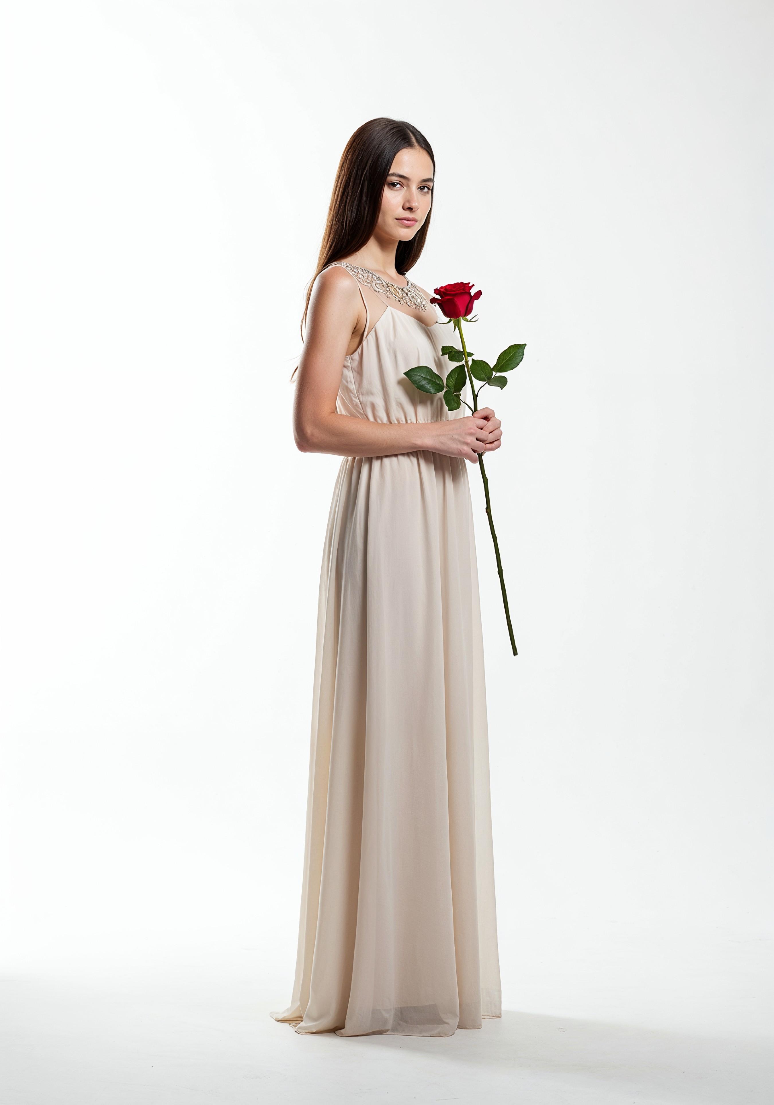 Beautiful Young Woman Holding Red Rose in Elegant Dress Romantic Portrait