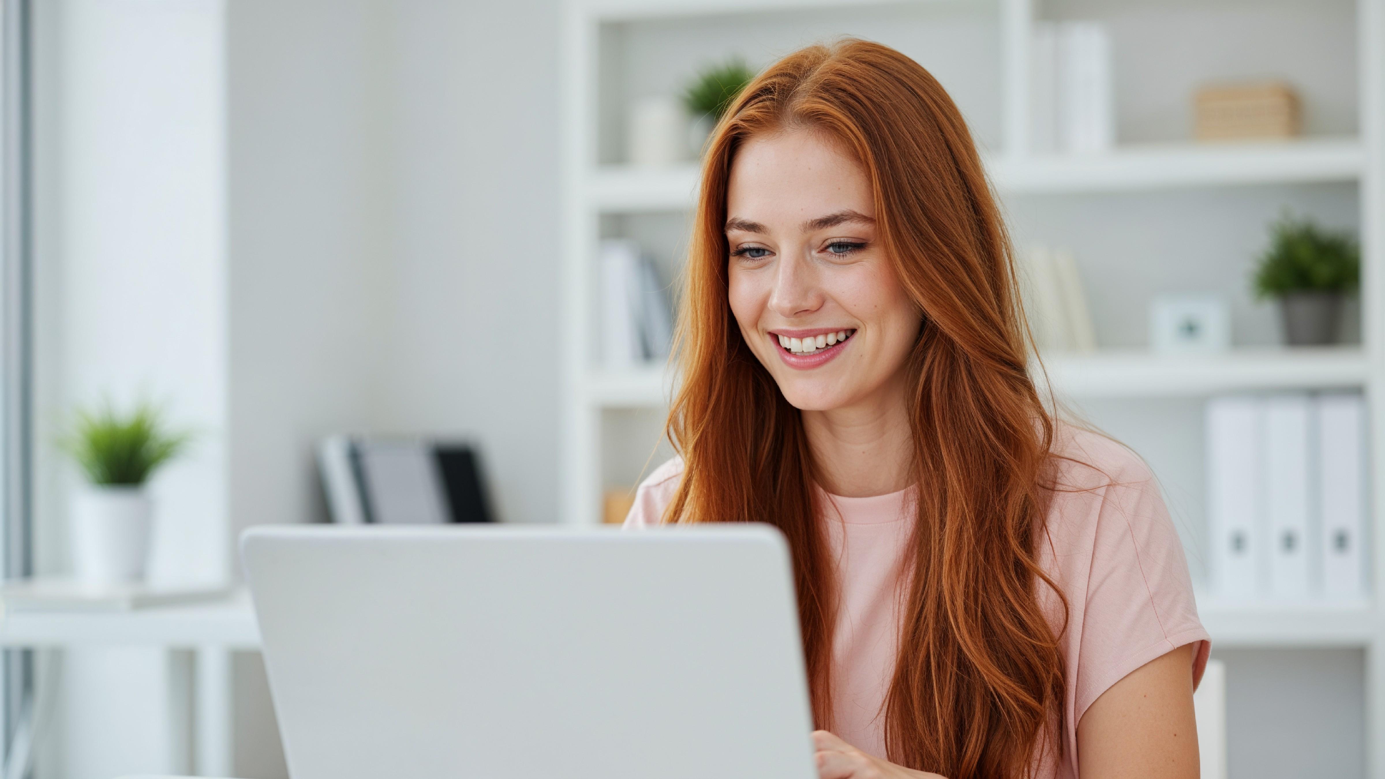 Beautiful Young Woman Working on Laptop at Modern Office Desk, Professional Business Portrait