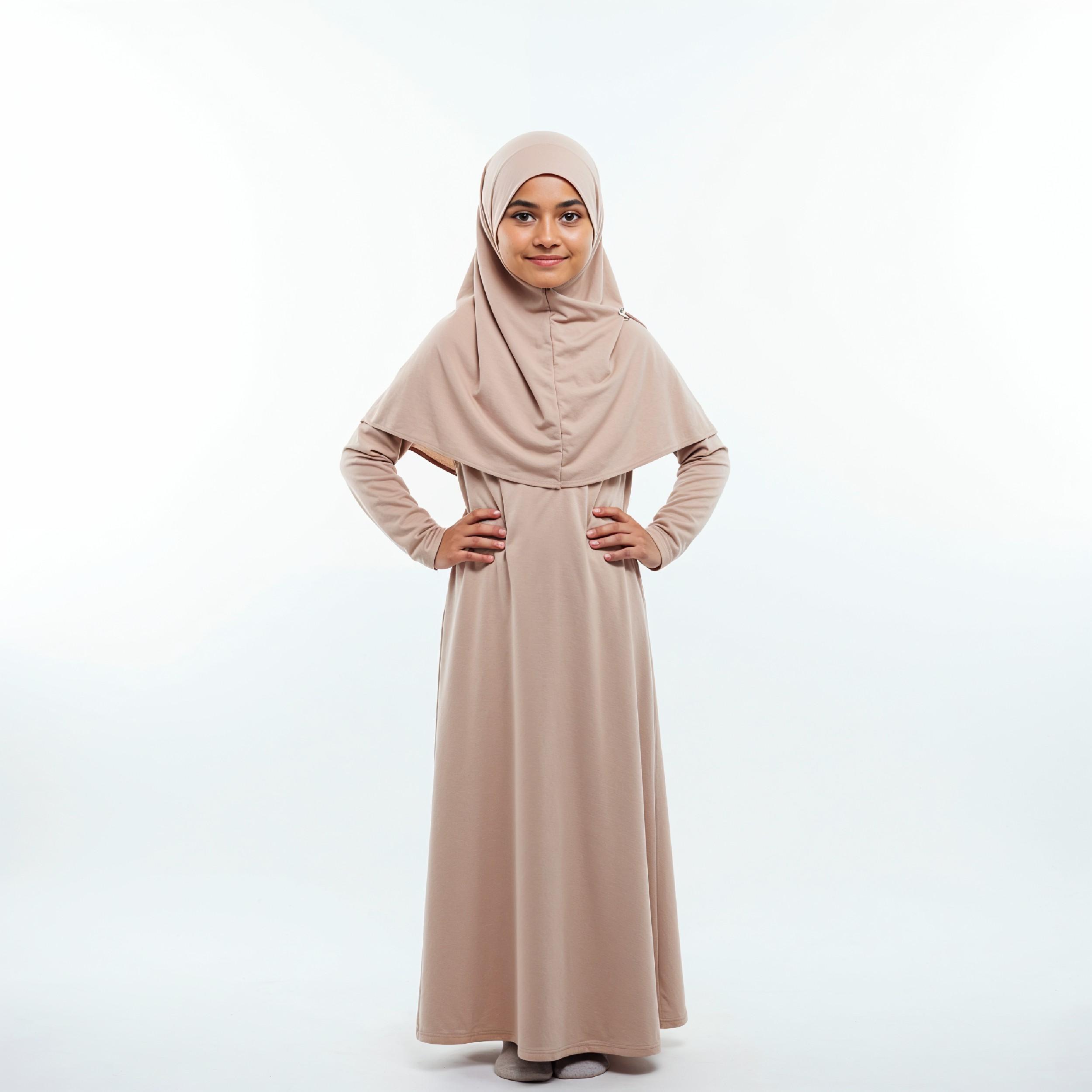 Cute Young Muslim Girl Wearing Beige Hijab and Modest Dress in Studio Portrait