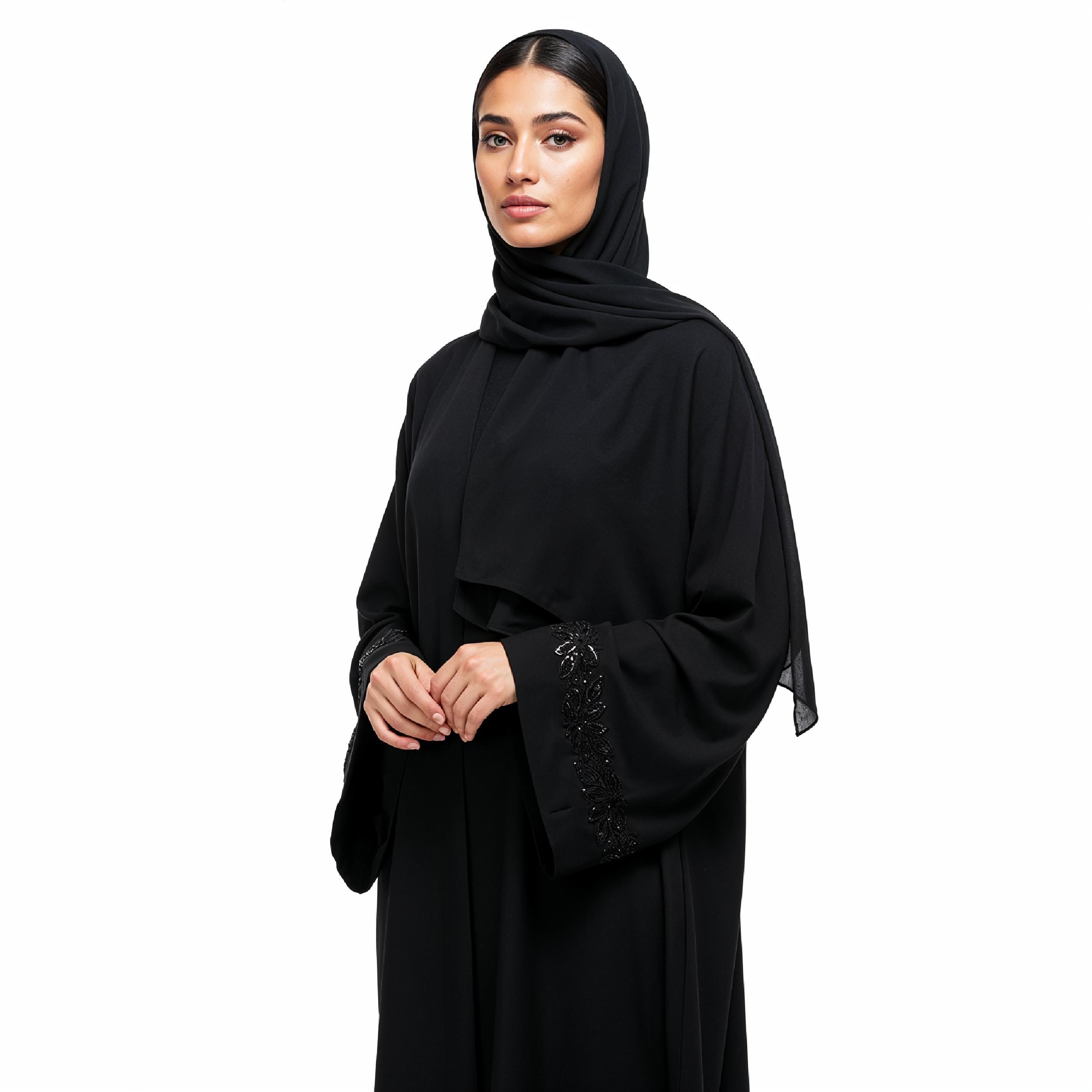 Elegant Muslim Woman Wearing Black Hijab and Abaya in Studio Portrait on Light Background