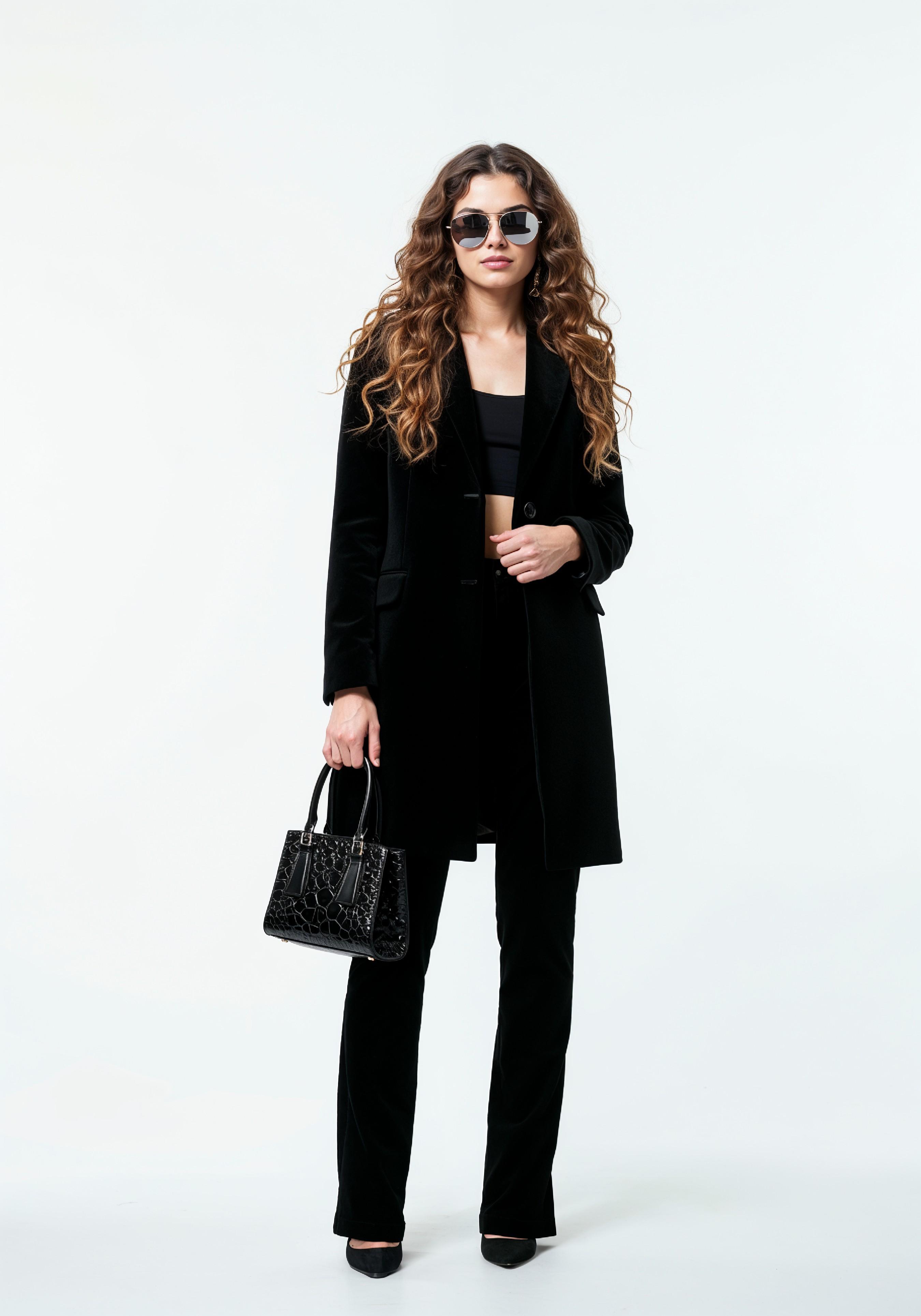 Elegant Young Woman in Coat and Matching Trousers Fashion Portrait