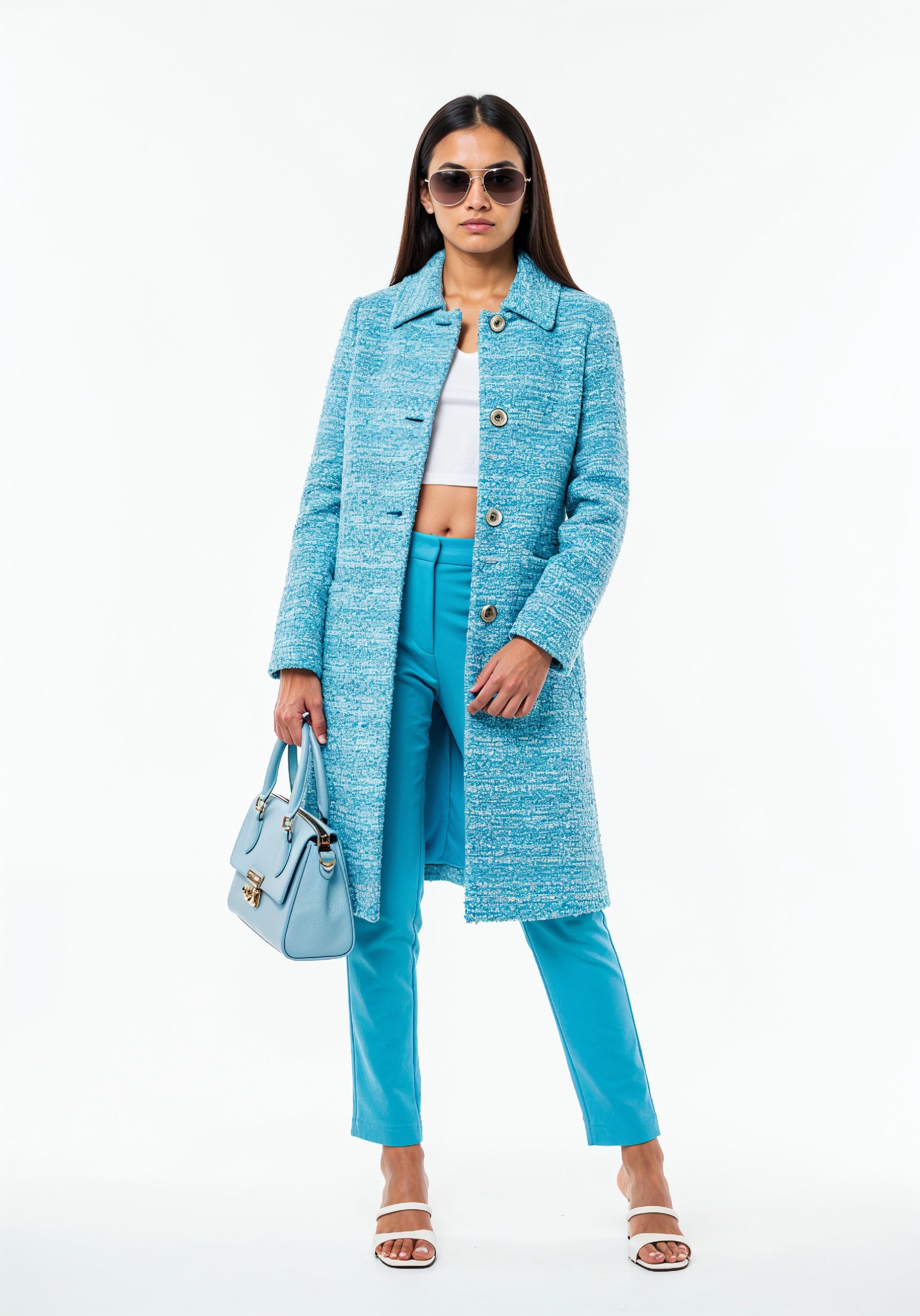 Elegant Young Woman in Coat and Matching Trousers Fashion Portrait
