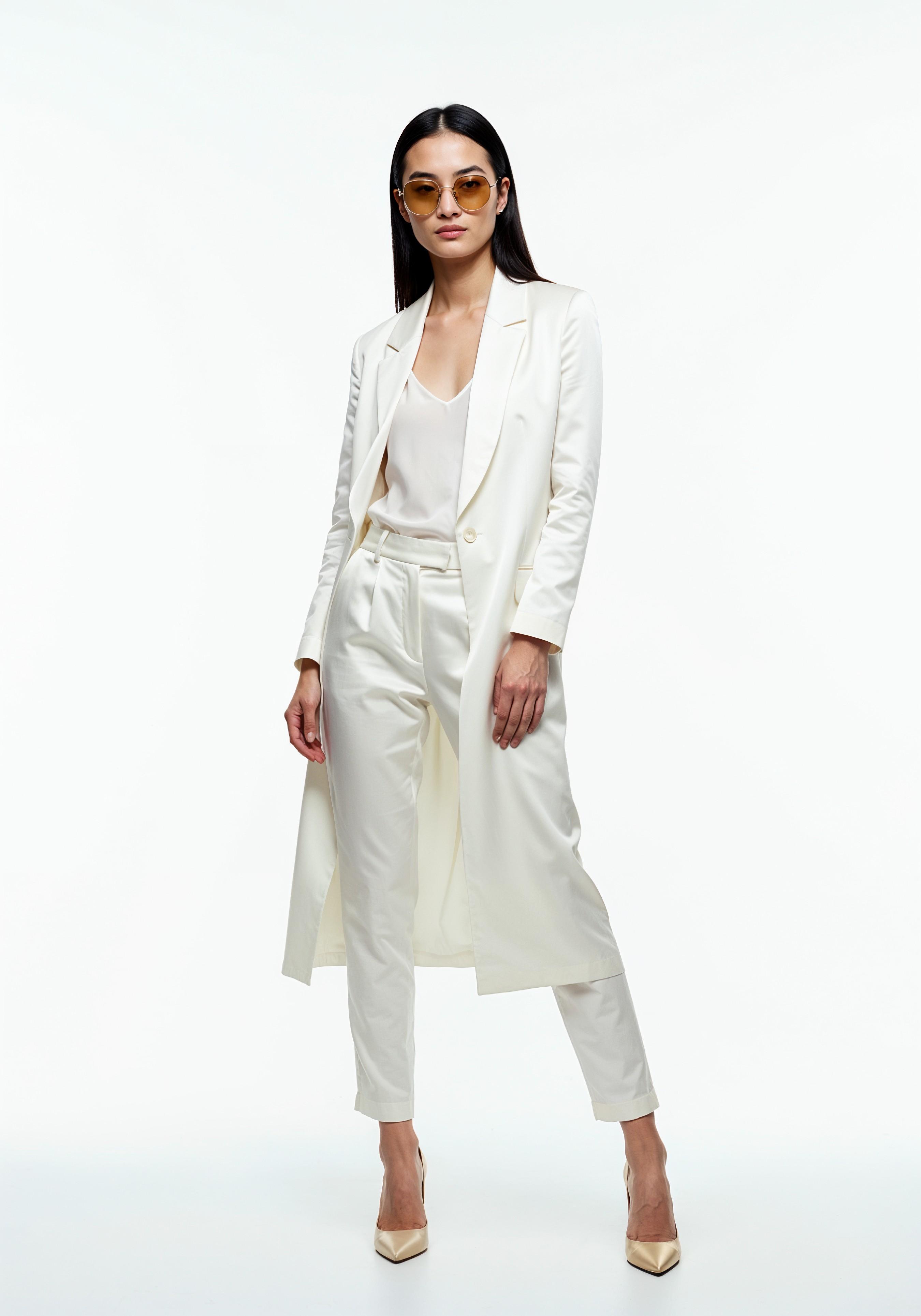 Elegant Young Woman in Coat and Matching Trousers Fashion Portrait