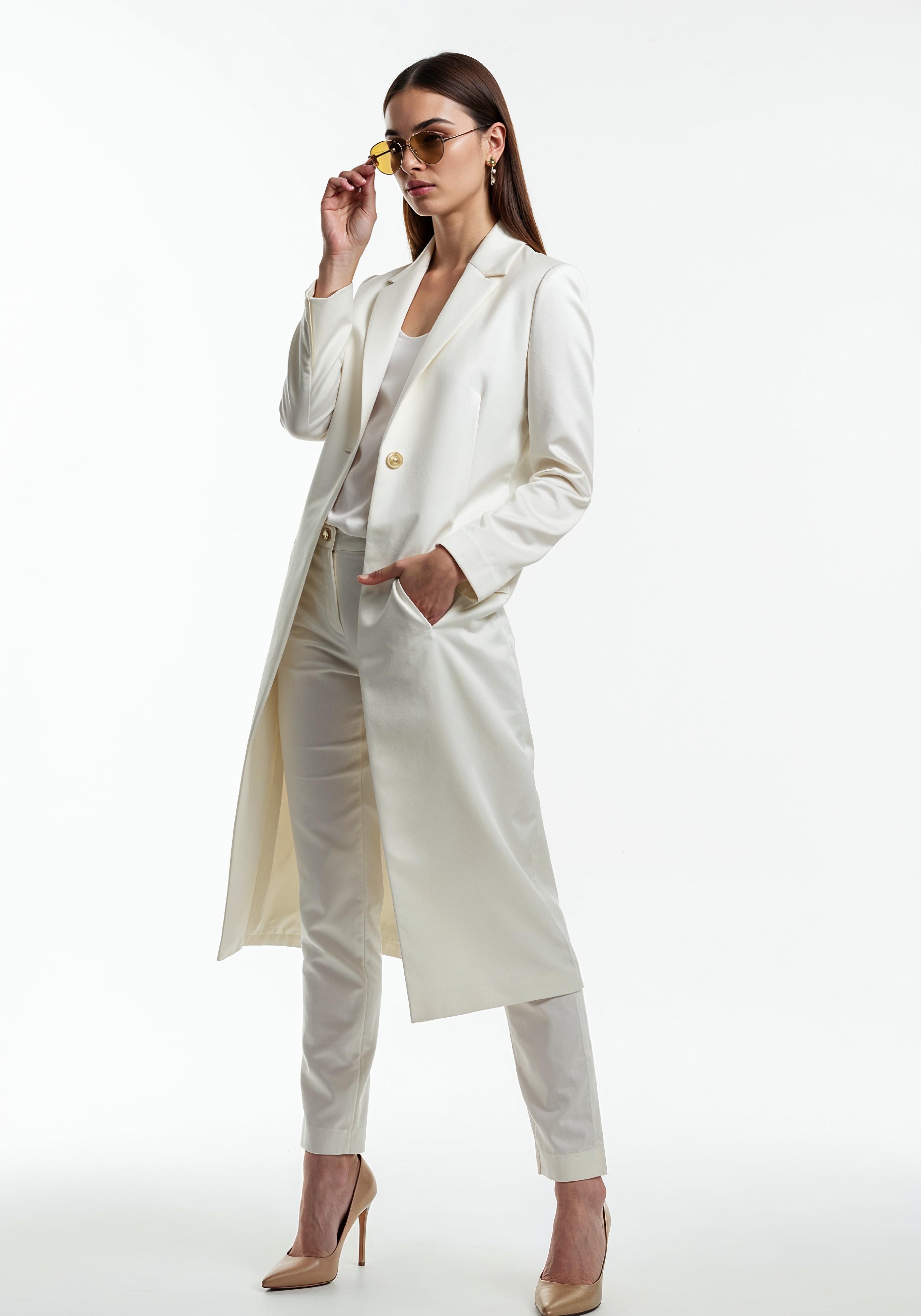 Elegant Young Woman in Coat and Matching Trousers Fashion Portrait