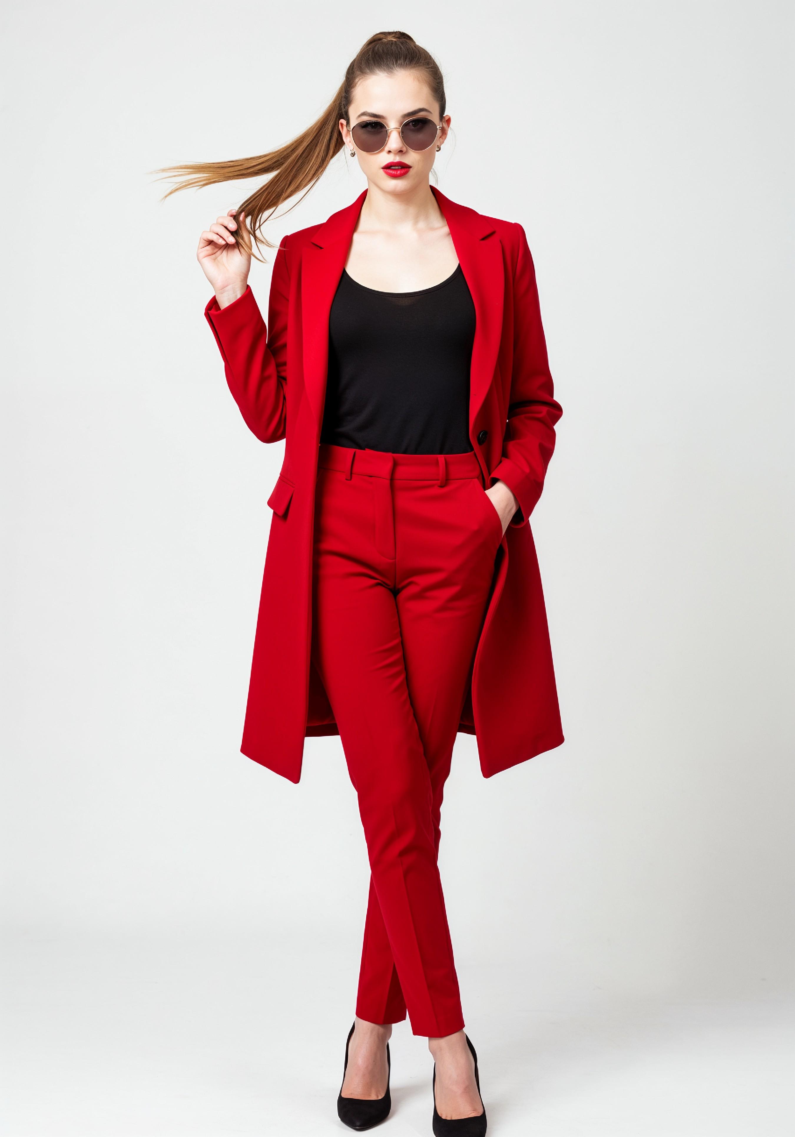 Elegant Young Woman in Coat and Matching Trousers Fashion Portrait
