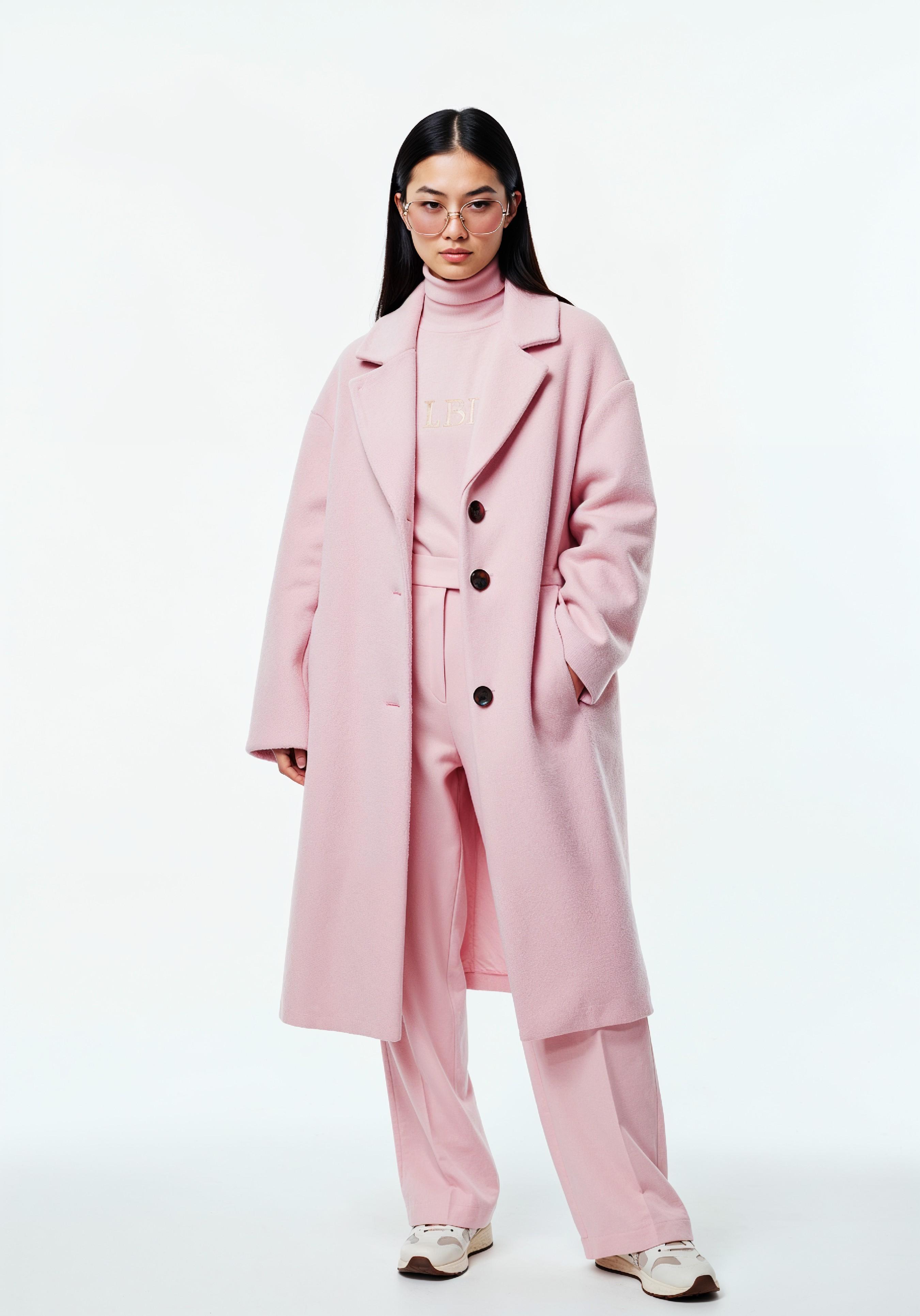 Elegant Young Woman in Coat and Matching Trousers Fashion Portrait