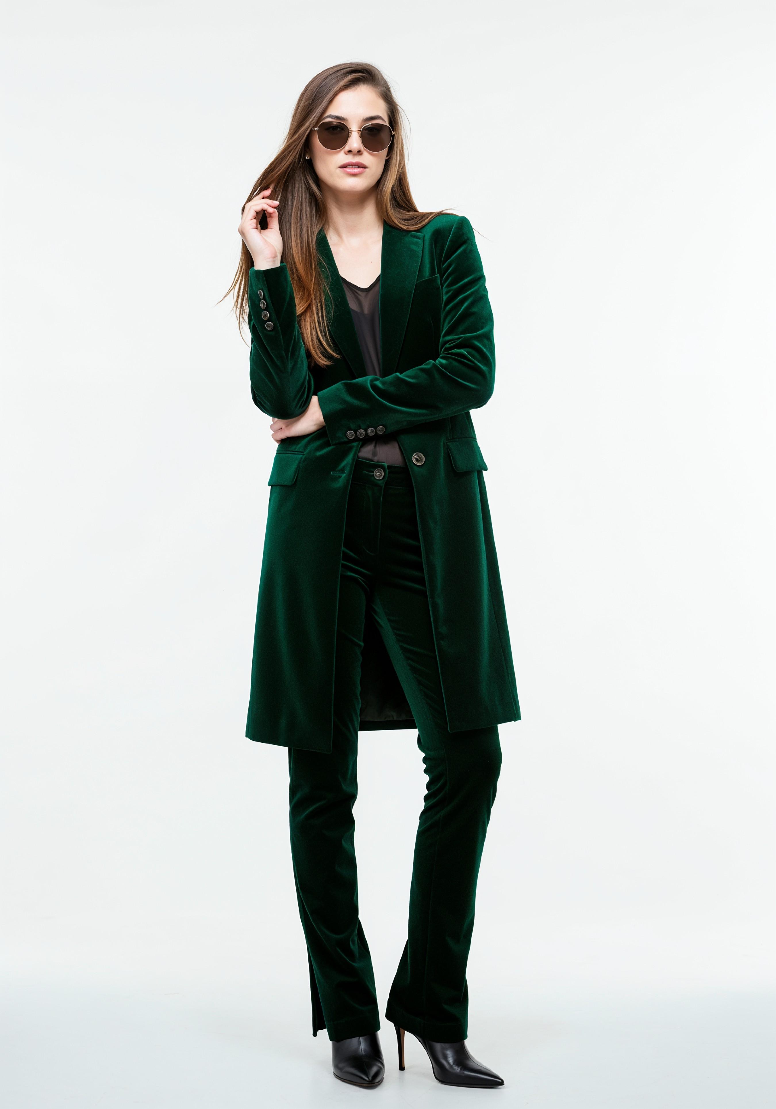 Elegant Young Woman in Coat and Matching Trousers Fashion Portrait