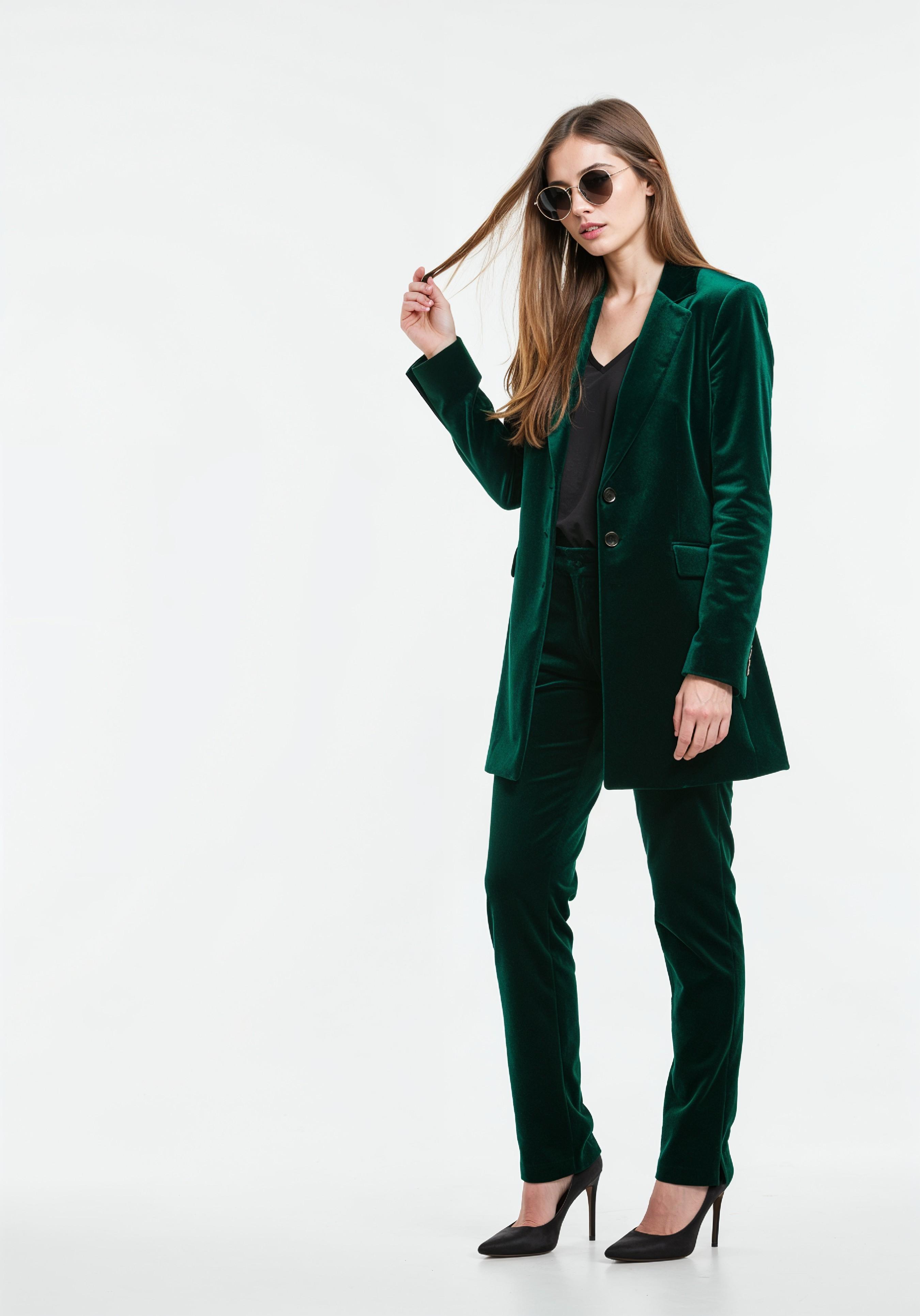 Elegant Young Woman in Coat and Matching Trousers Fashion Portrait