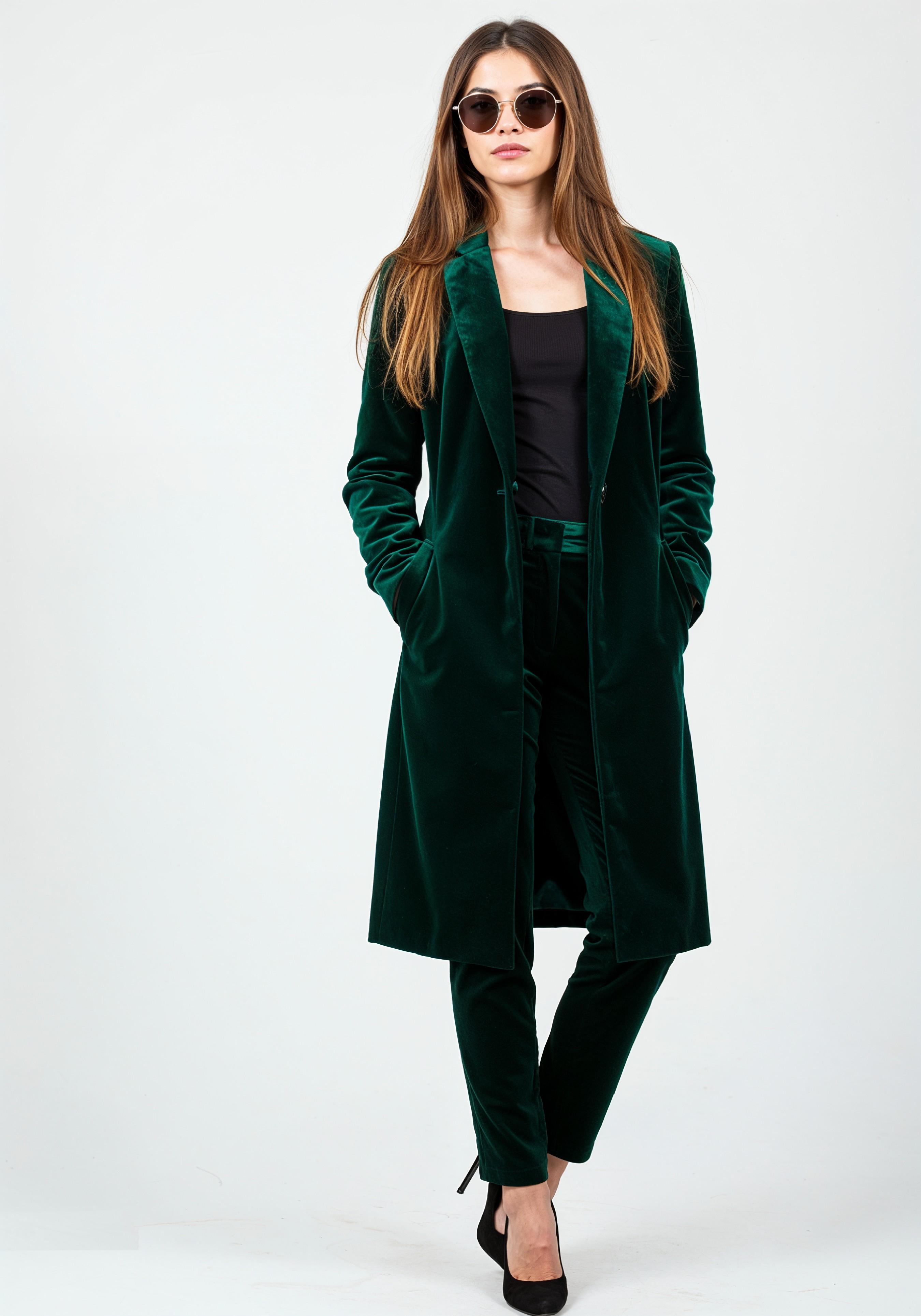 Elegant Young Woman in Coat and Matching Trousers Fashion Portrait