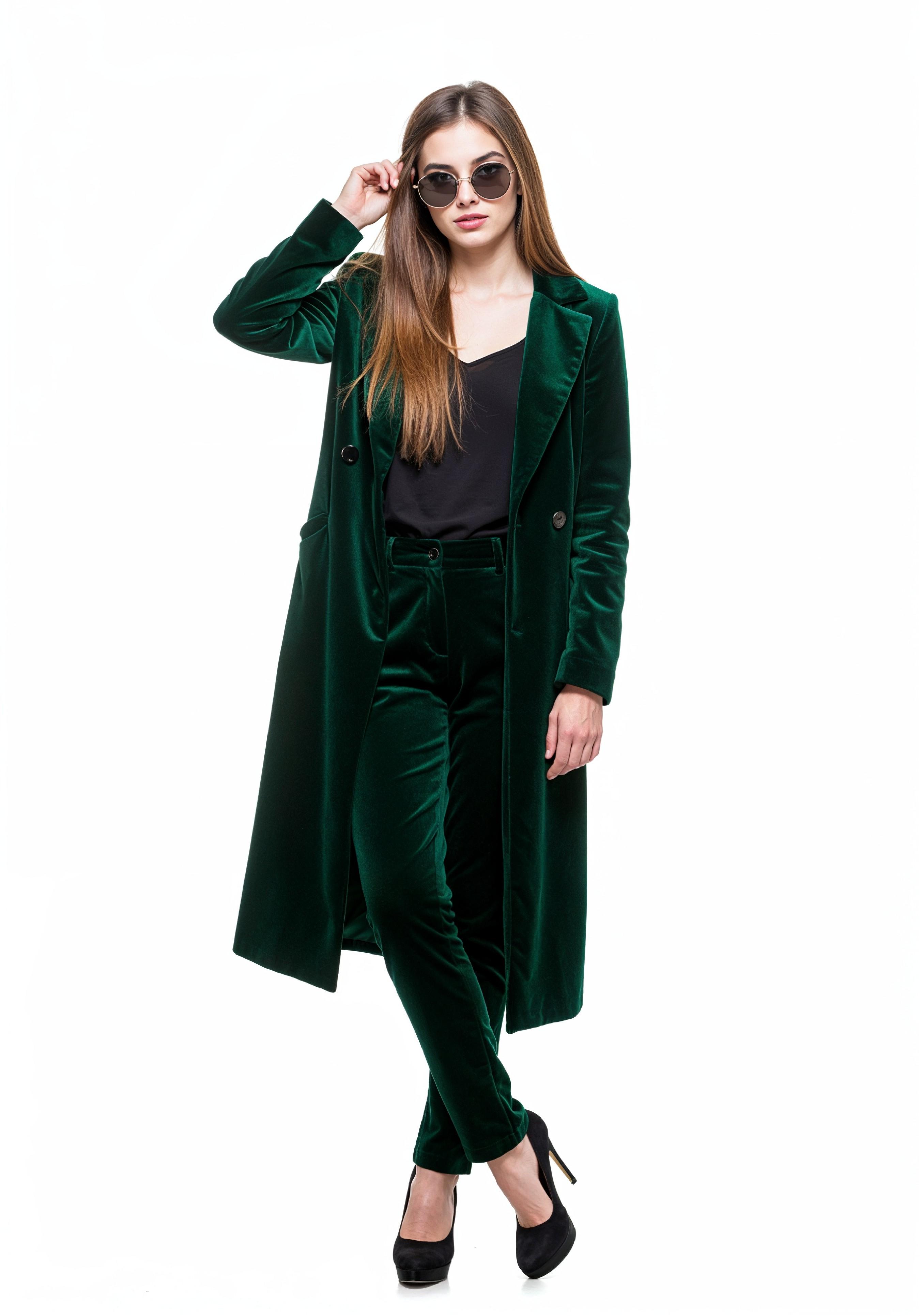 Elegant Young Woman in Coat and Matching Trousers Fashion Portrait