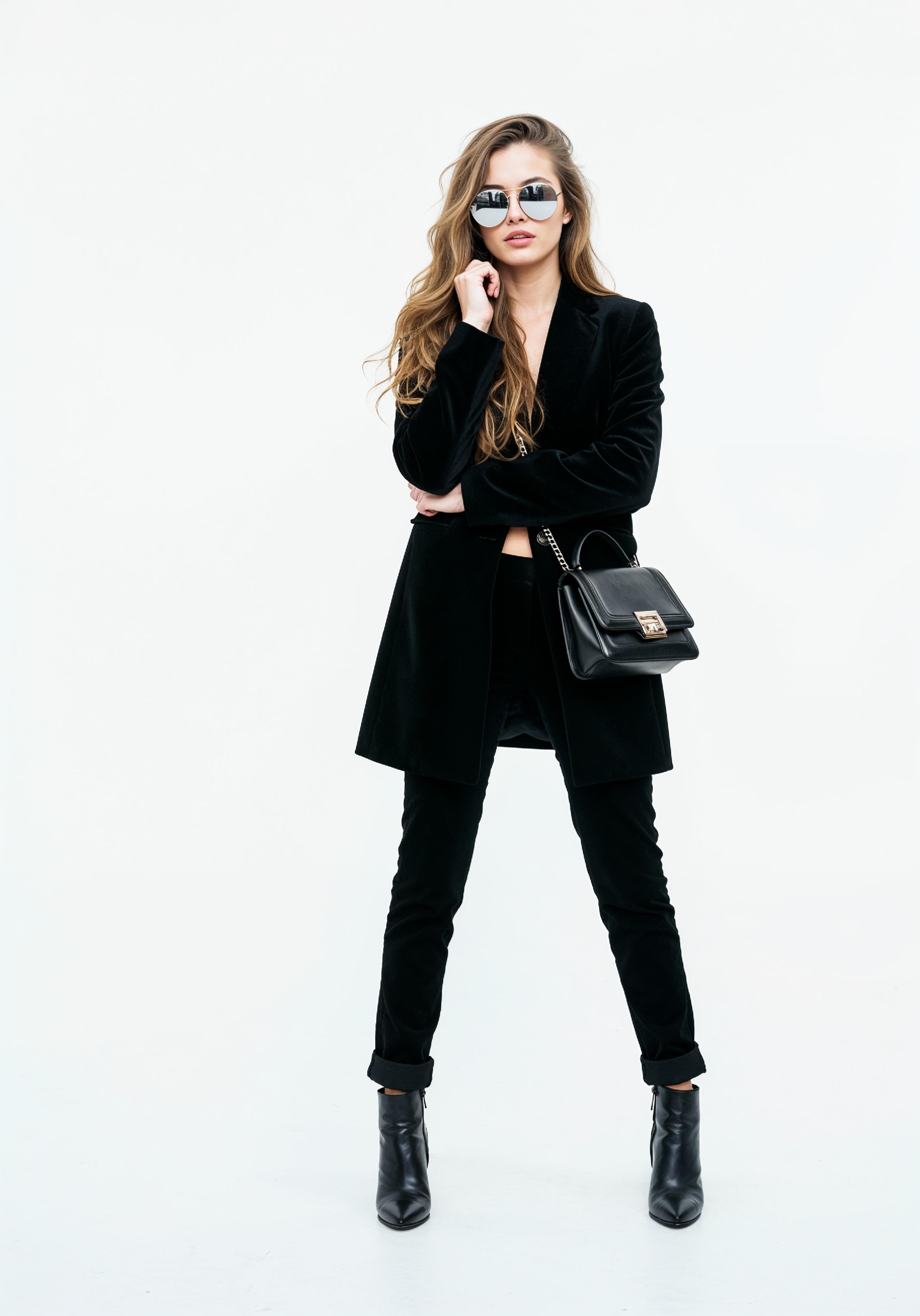 Elegant Young Woman in Coat and Matching Trousers Fashion Portrait