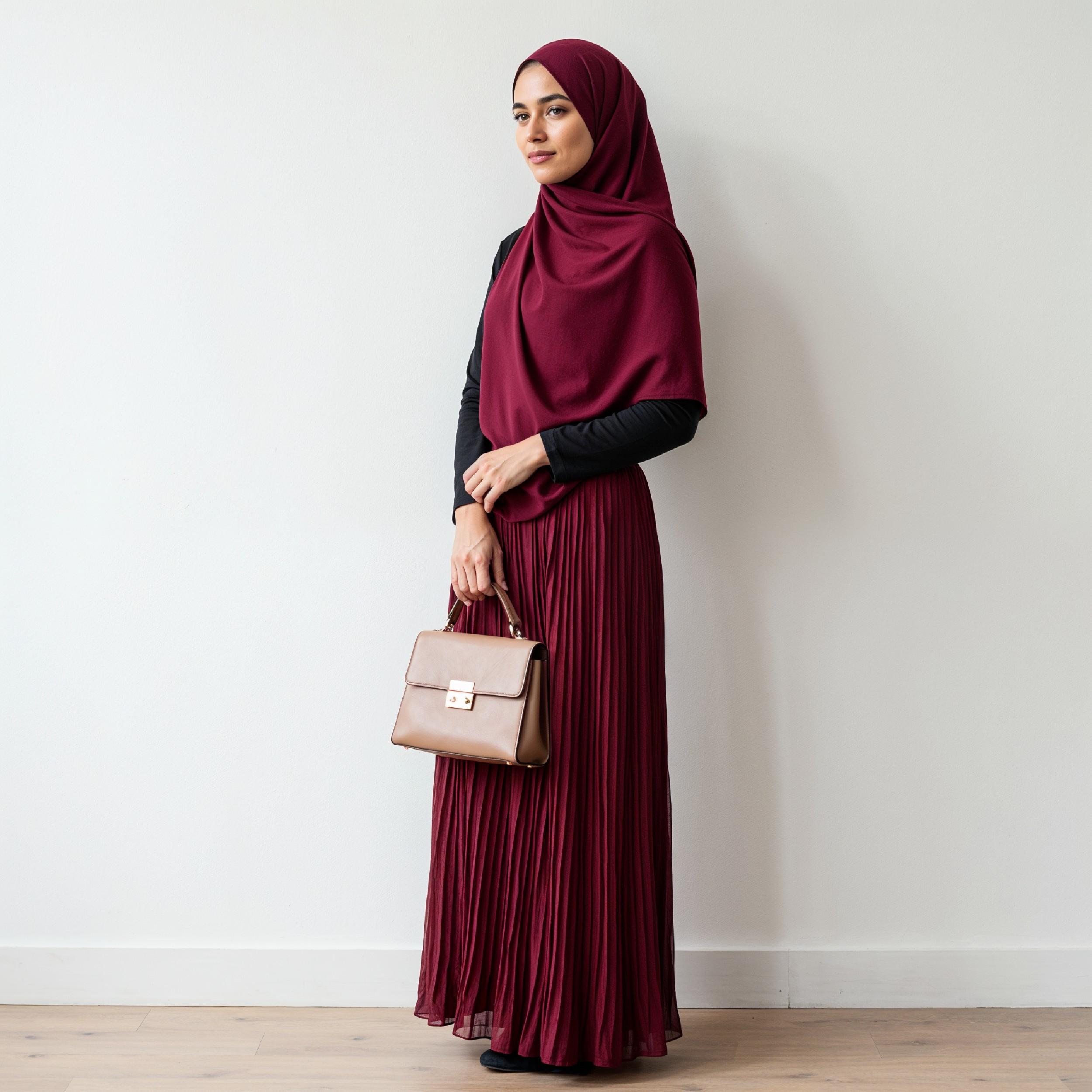 Fashionable Muslim Woman Wearing Maroon Hijab and Elegant Modest Outfit with Handbag