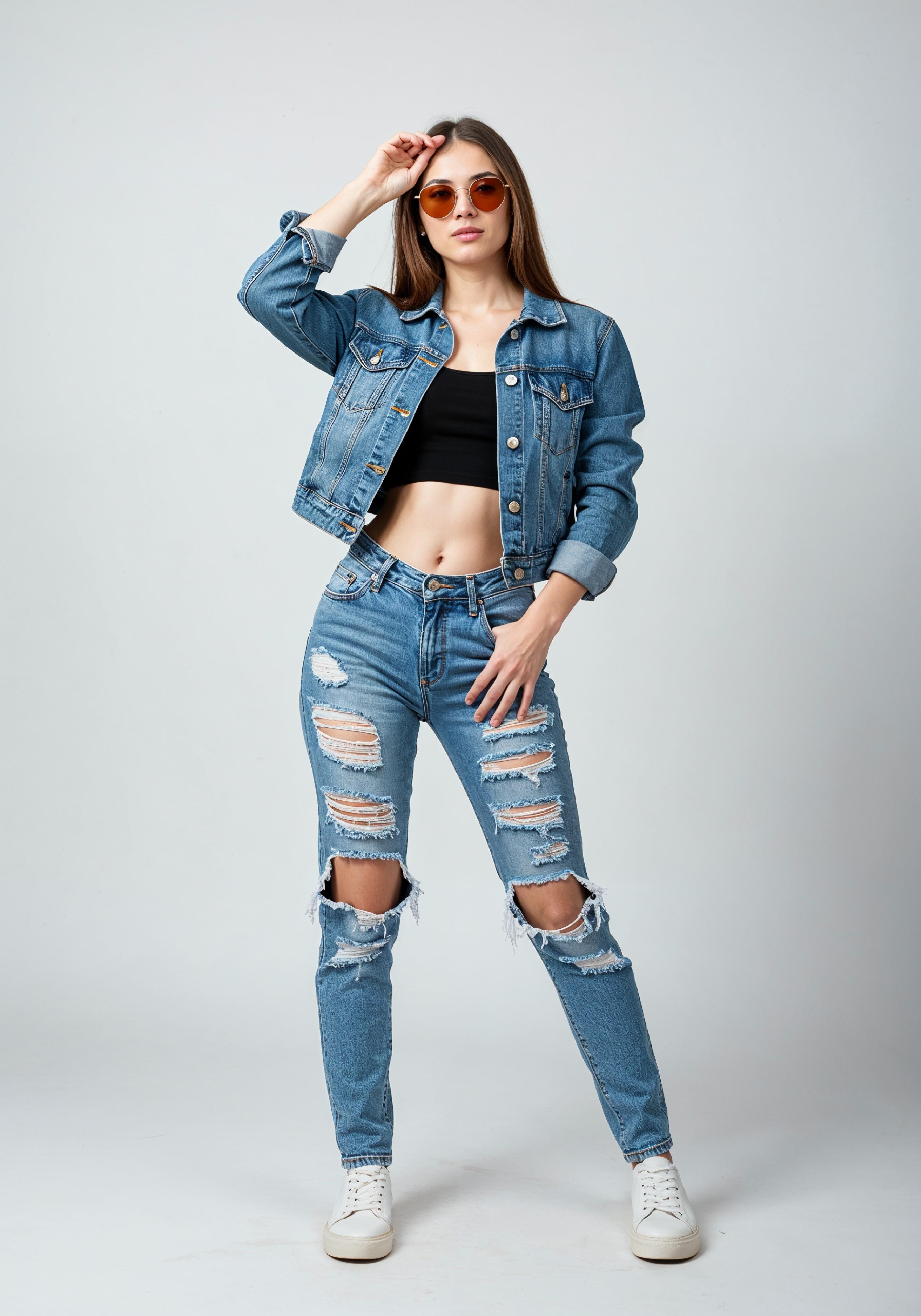 Fashionable Young Woman in Ripped Denim Jeans and Jacket Casual Street Style Portrait