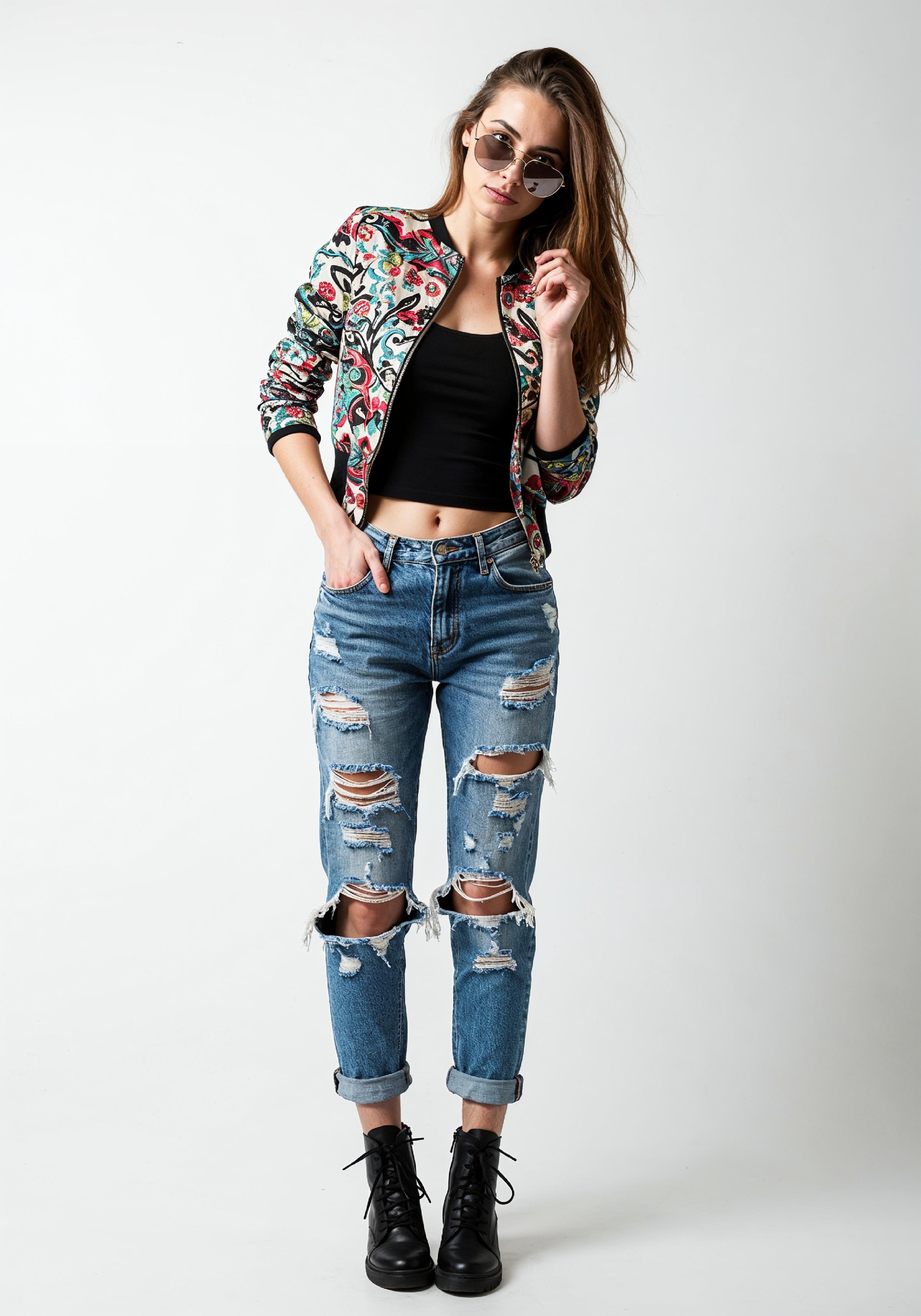 Stylish Young Woman in Floral Jacket and Ripped Jeans Trendy Street Fashion Portrait