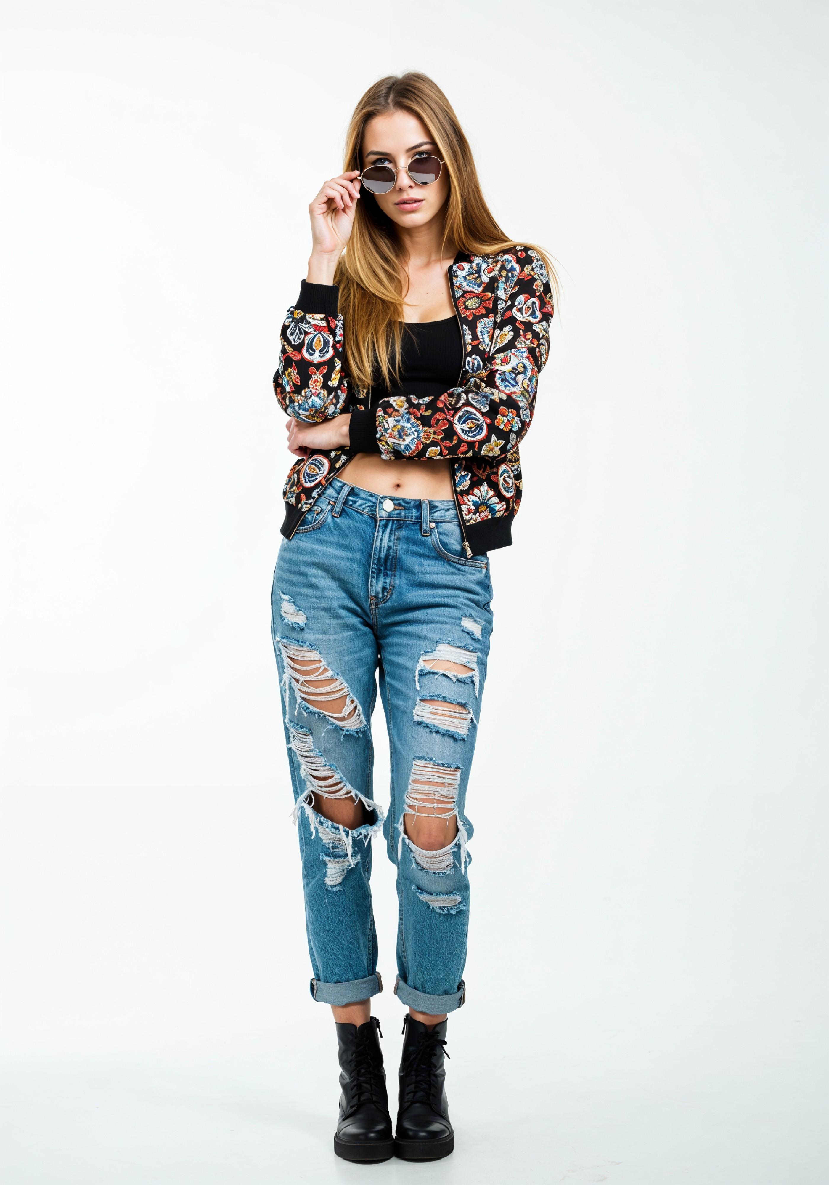 Stylish Young Woman in Floral Jacket and Ripped Jeans Trendy Street Fashion Portrait