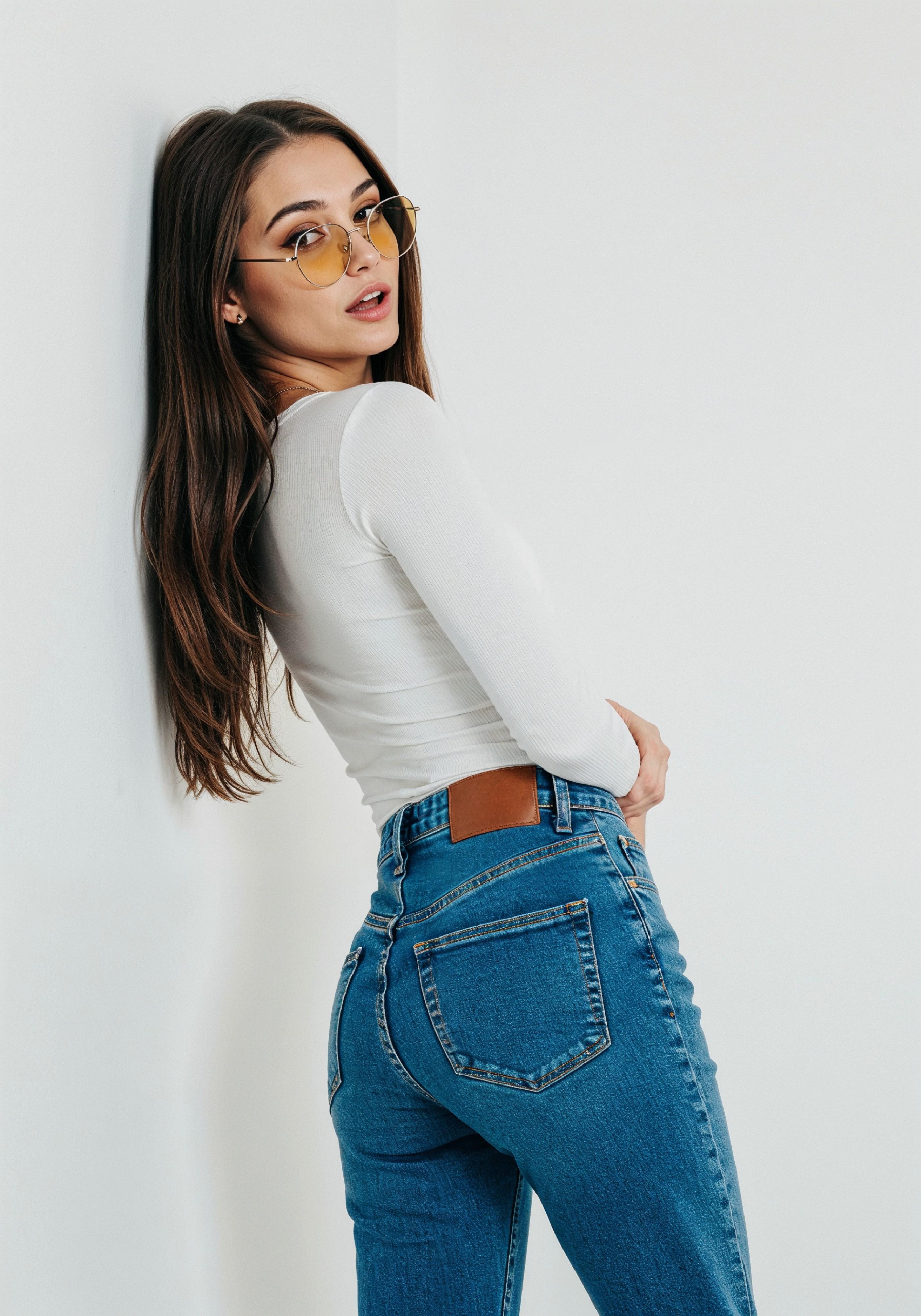 Stylish Young Woman in High Waist Jeans and White T Shirt Casual Fashion Portrait