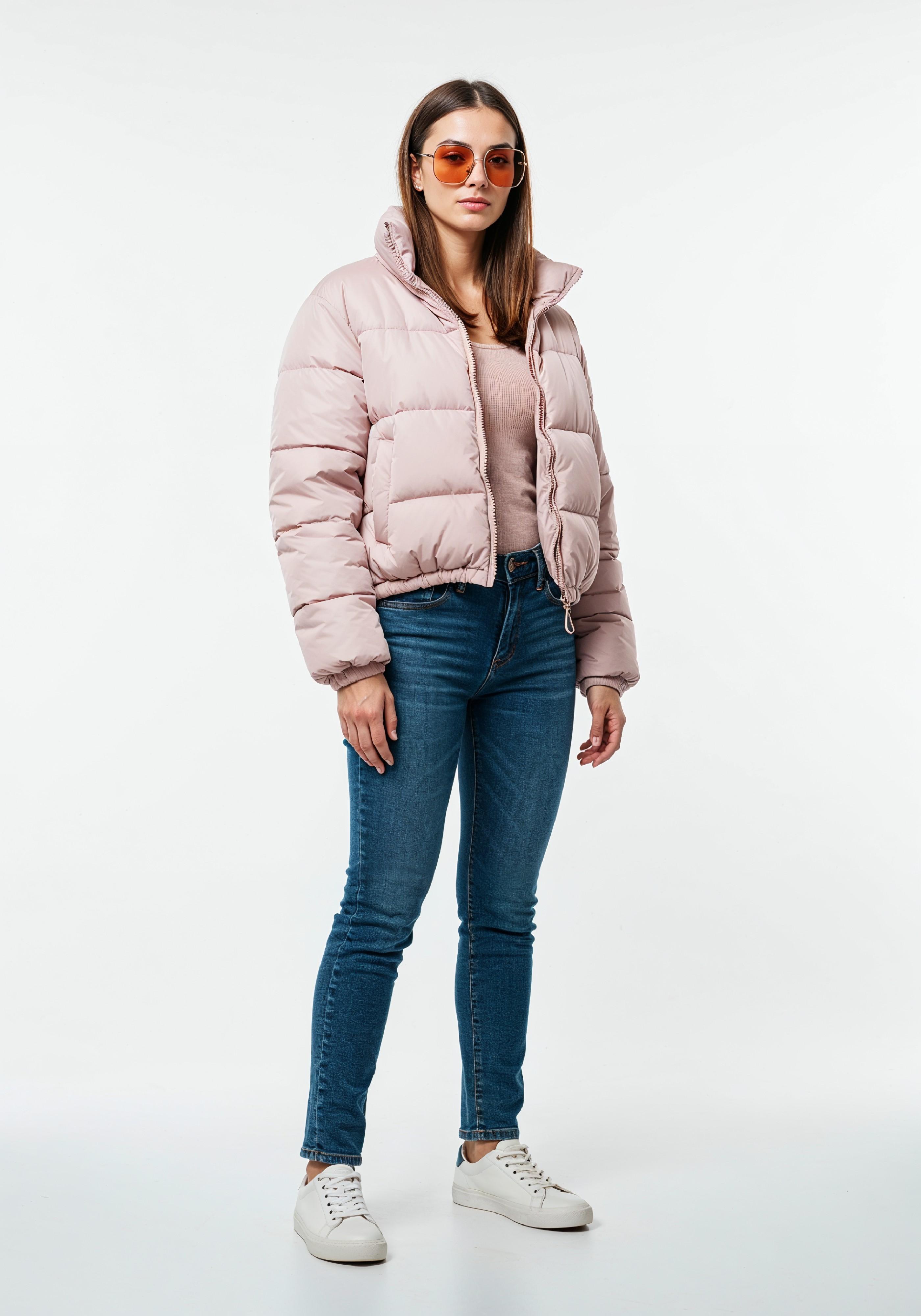 Stylish Young Woman in Pink Puffer Jacket and Blue Jeans Winter Fashion Portrait