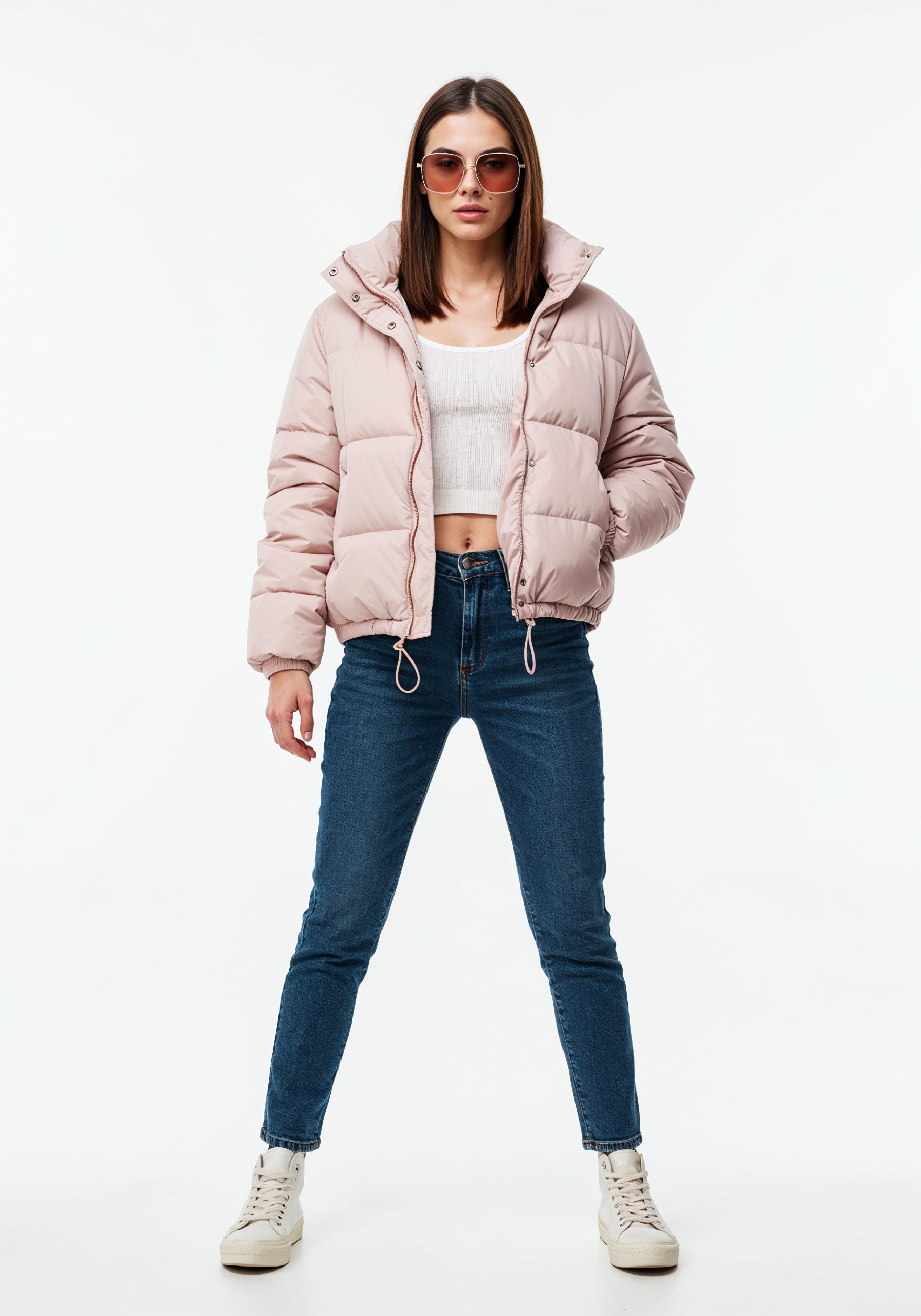 Stylish Young Woman in Pink Puffer Jacket and Blue Jeans Winter Fashion Portrait