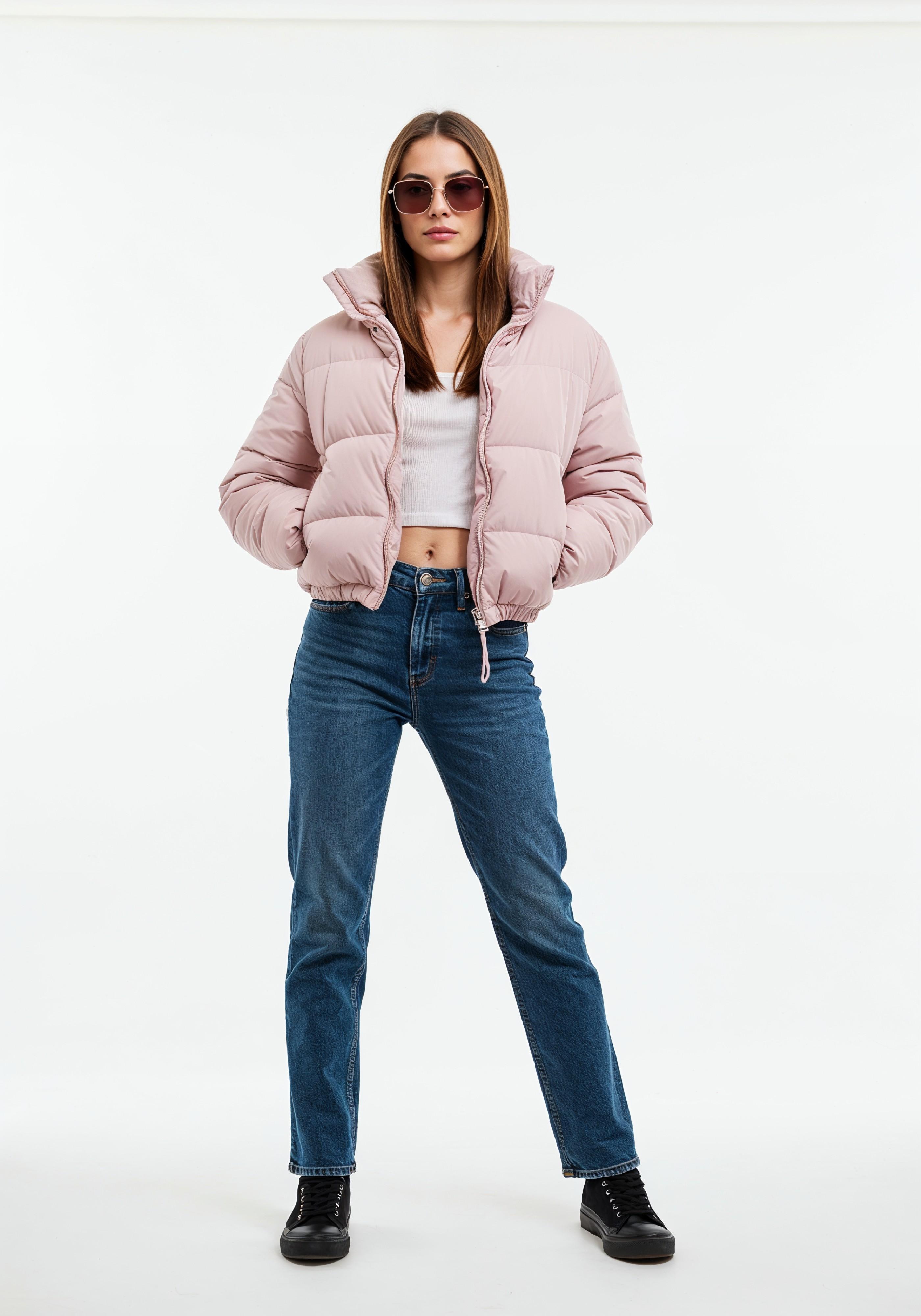 Stylish Young Woman in Pink Puffer Jacket and Blue Jeans Winter Fashion Portrait