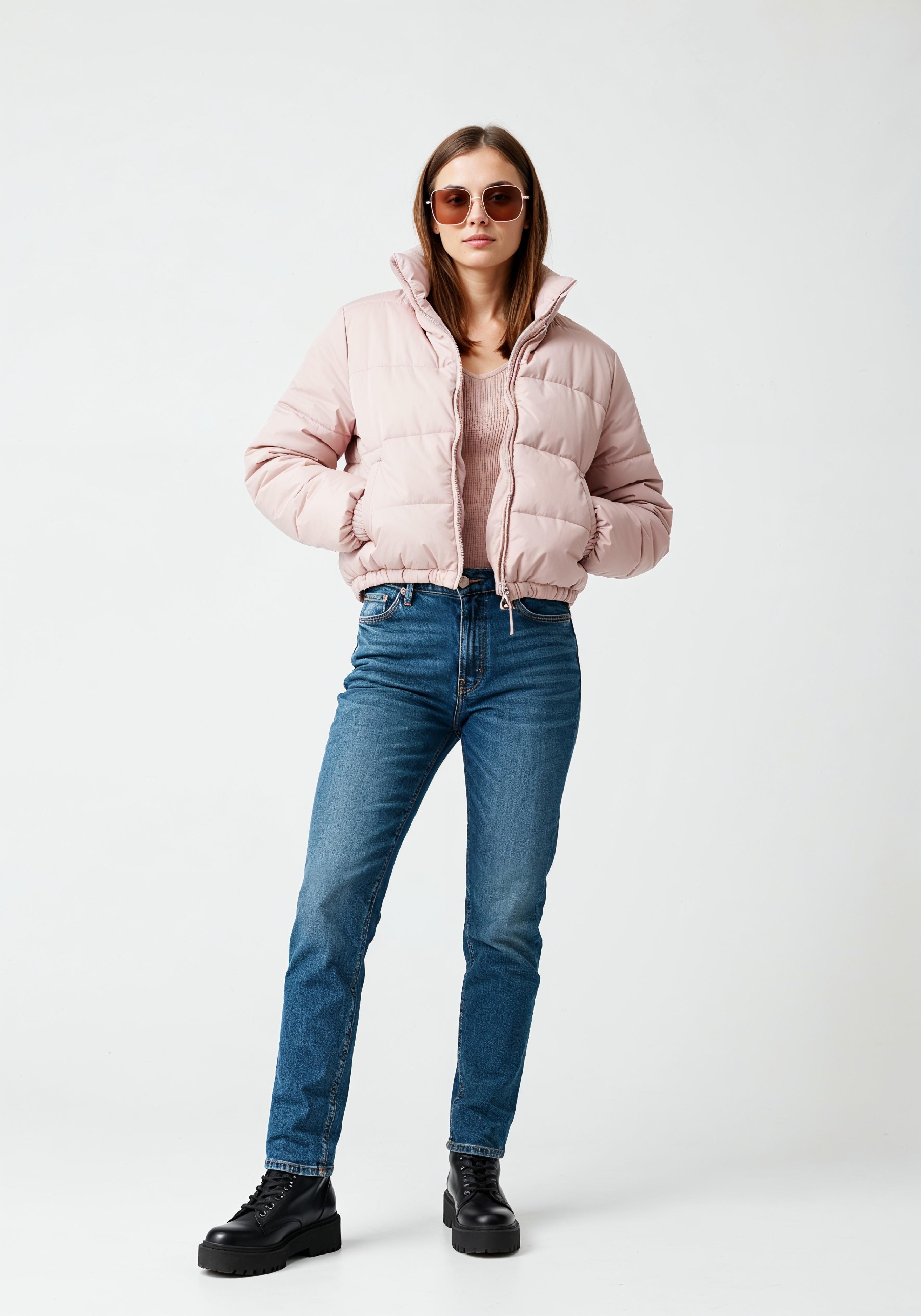 Stylish Young Woman in Pink Puffer Jacket and Blue Jeans Winter Fashion Portrait