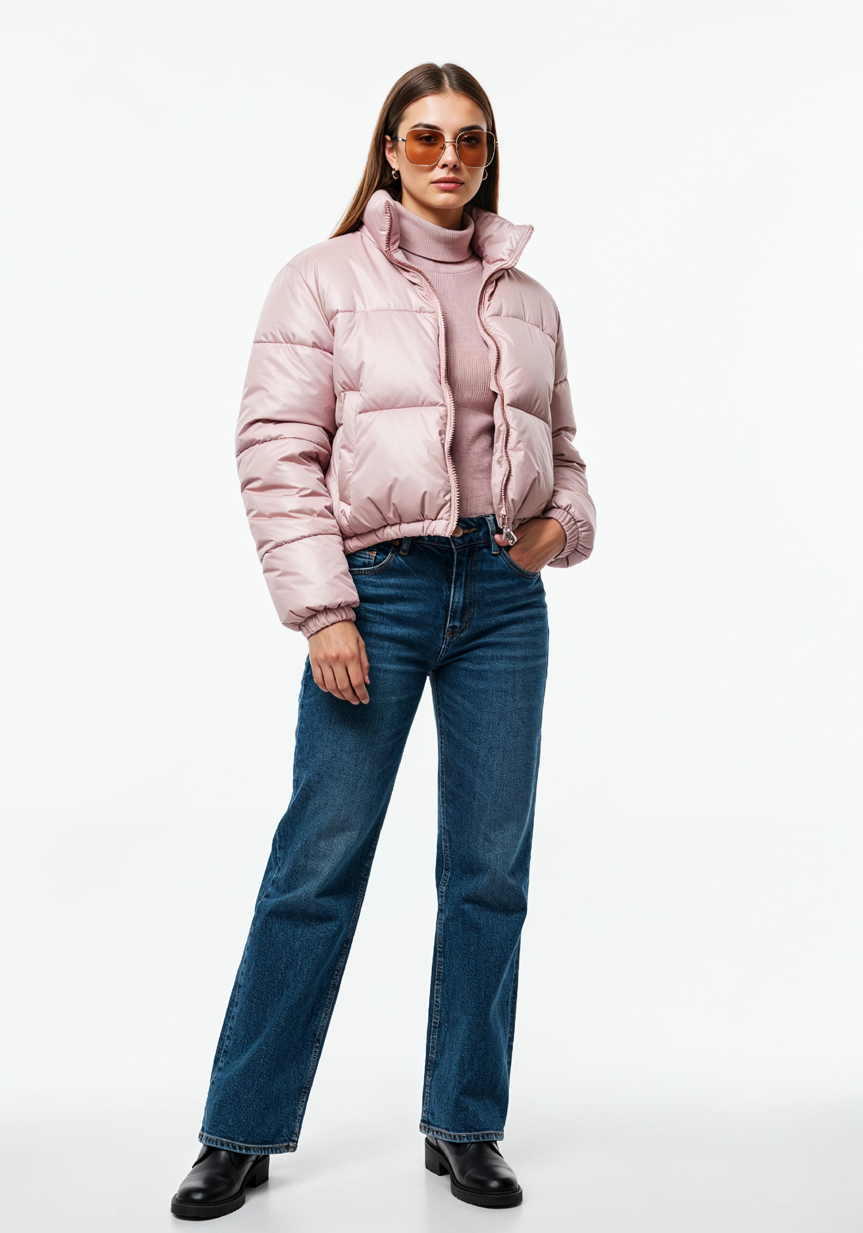 Stylish Young Woman in Pink Puffer Jacket and Blue Jeans Winter Fashion Portrait