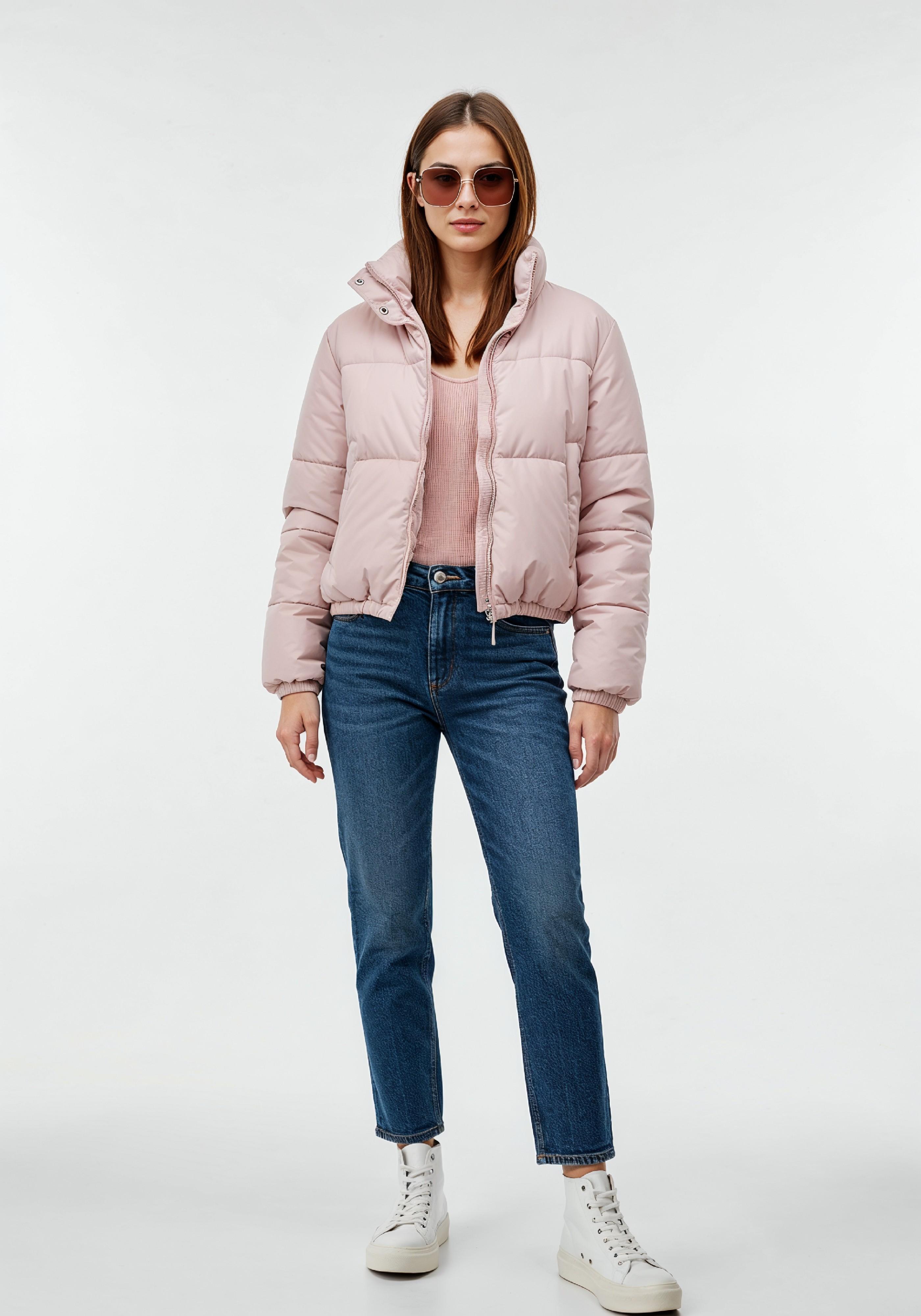 Stylish Young Woman in Pink Puffer Jacket and Blue Jeans Winter Fashion Portrait