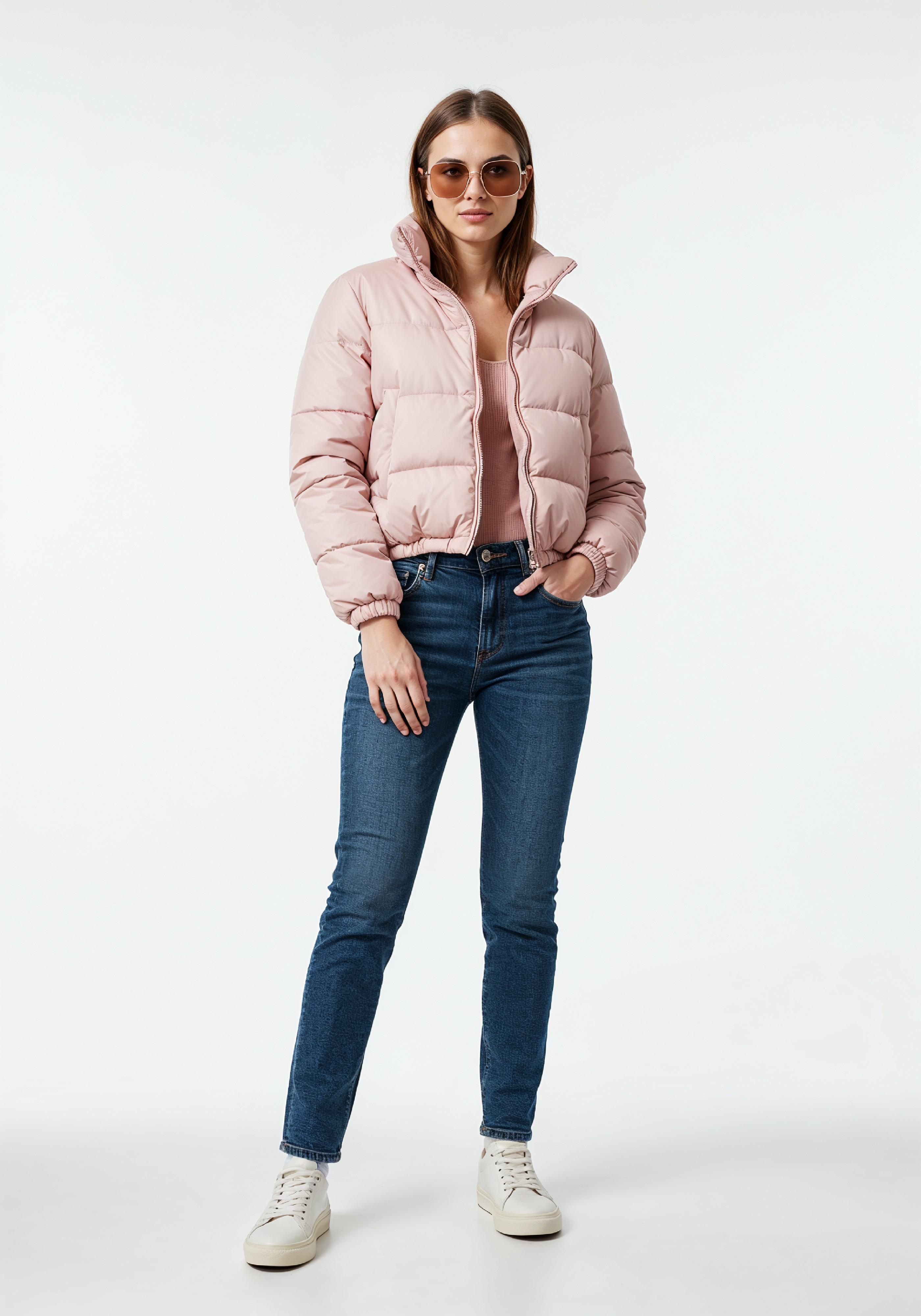 Stylish Young Woman in Pink Puffer Jacket and Blue Jeans Winter Fashion Portrait