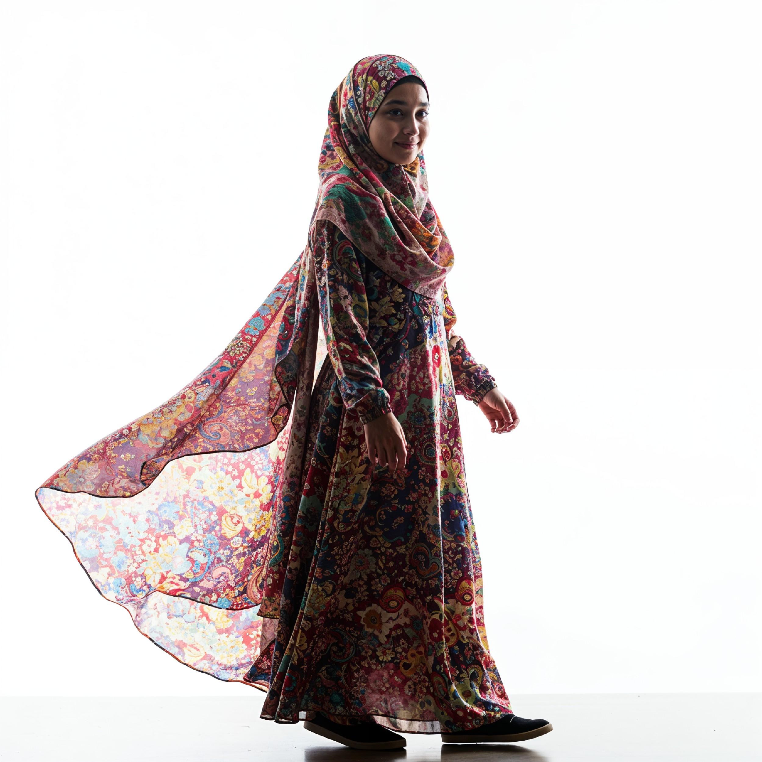 Young Islamic Girl Wearing Colorful Patterned Hijab and Elegant Modest Dress in Studio Portrait