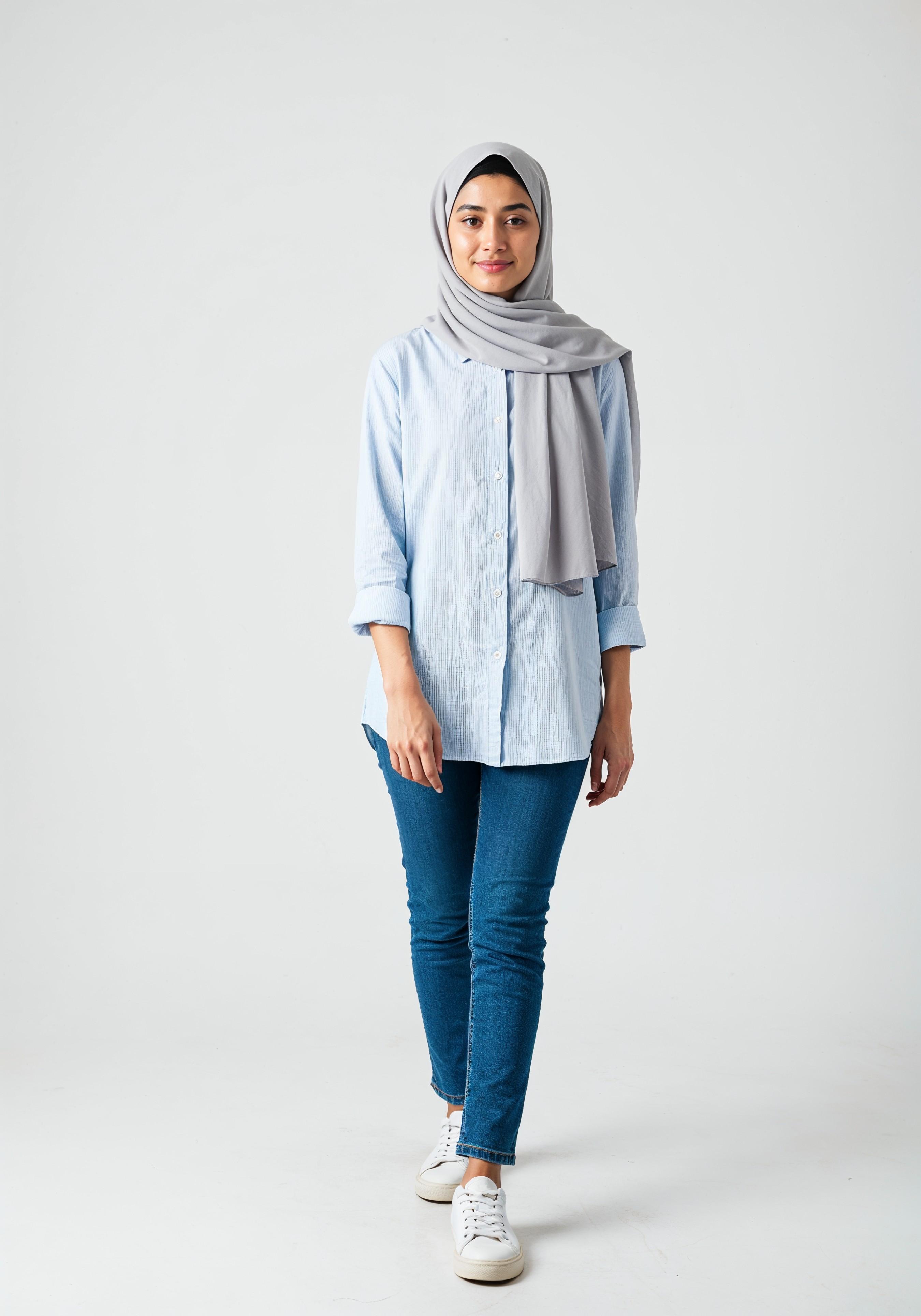 Young Muslim Woman in Modest Traditional Attire Educational Portrait