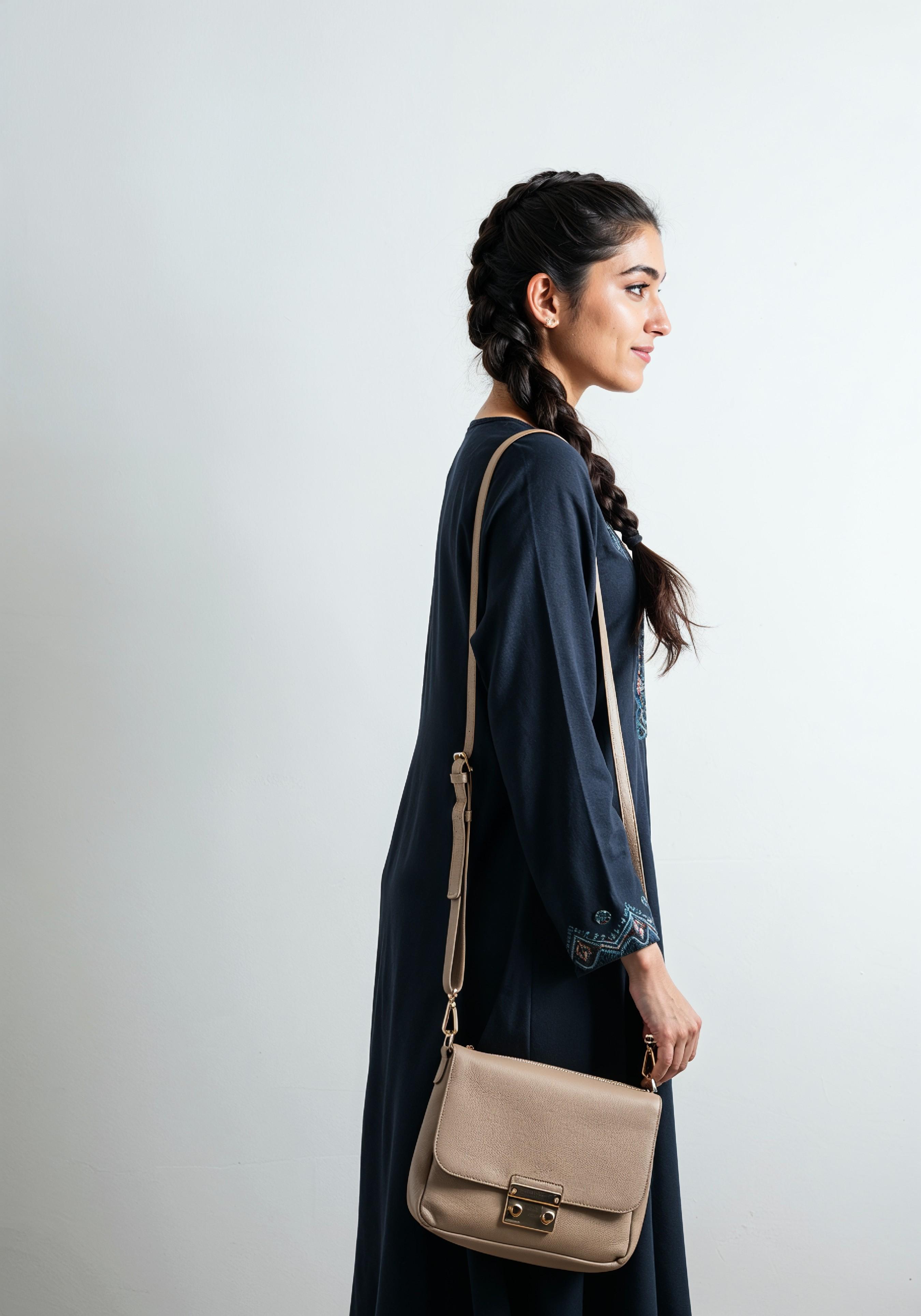 Young Muslim Woman in Modest Traditional Attire Educational Portrait