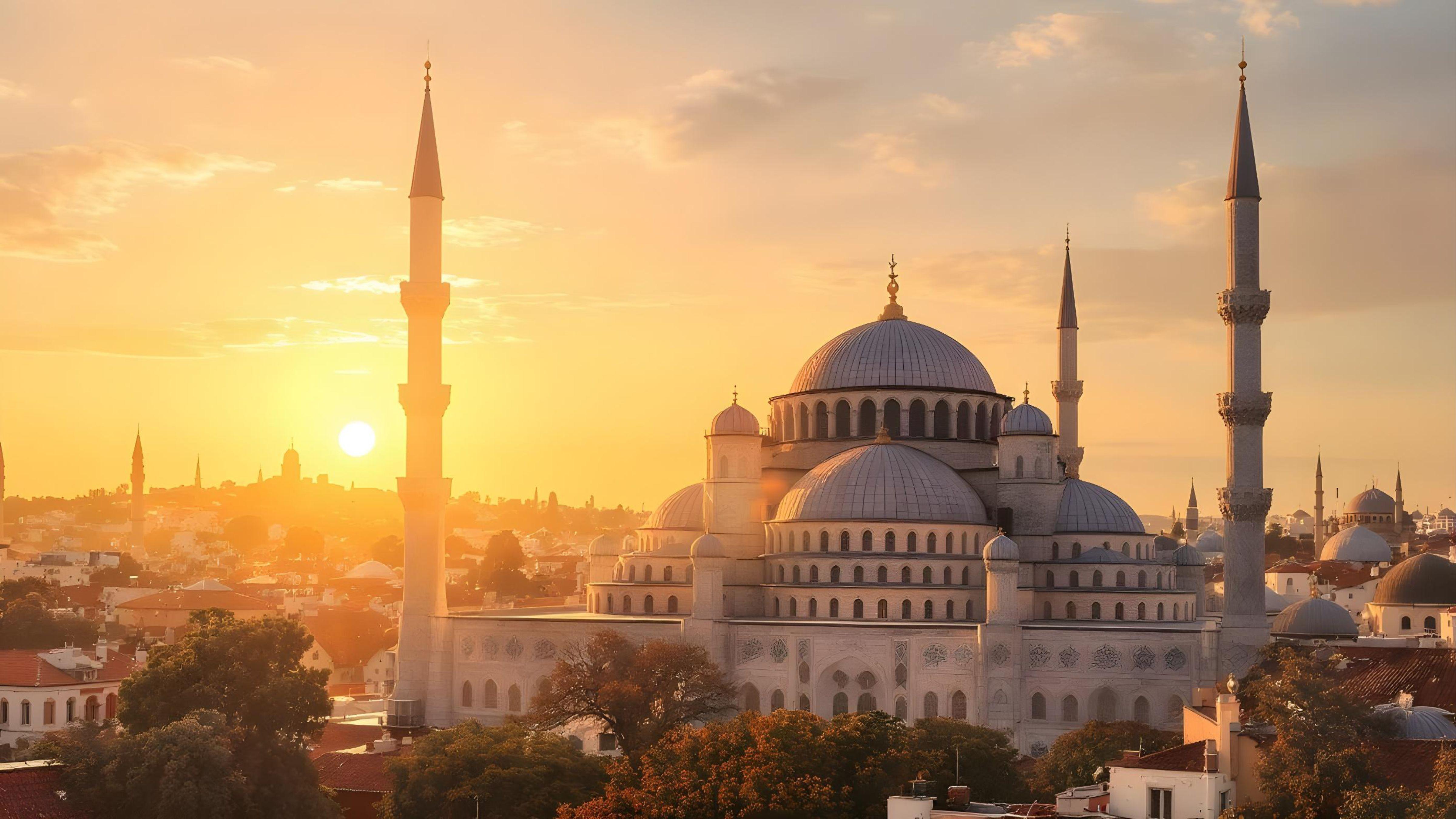 Beautiful Islamic Mosque at Sunset with Majestic Minarets and Golden Sky
