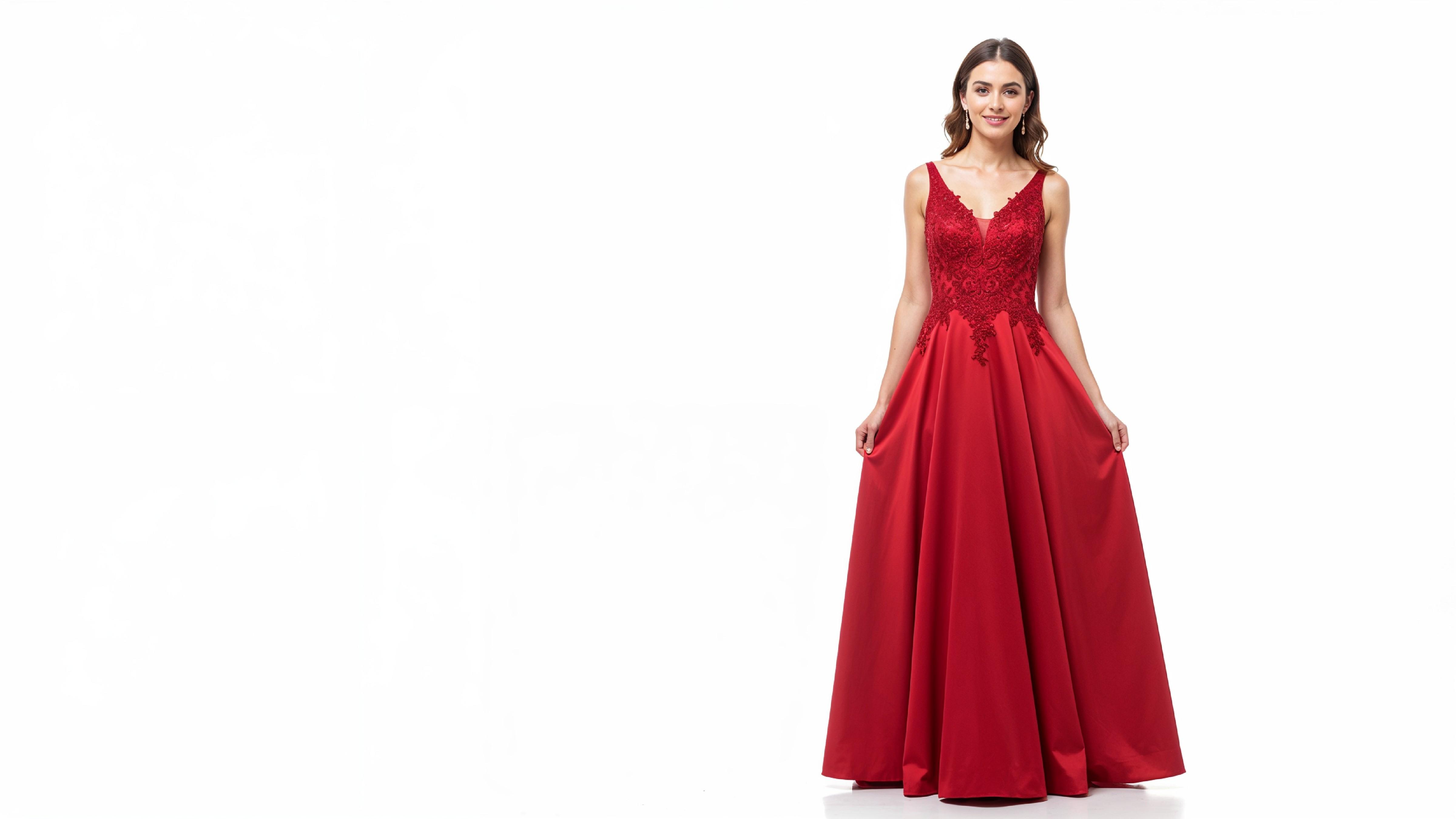 Elegant Young Woman in Flowing Red Evening Gown Fashion Portrait