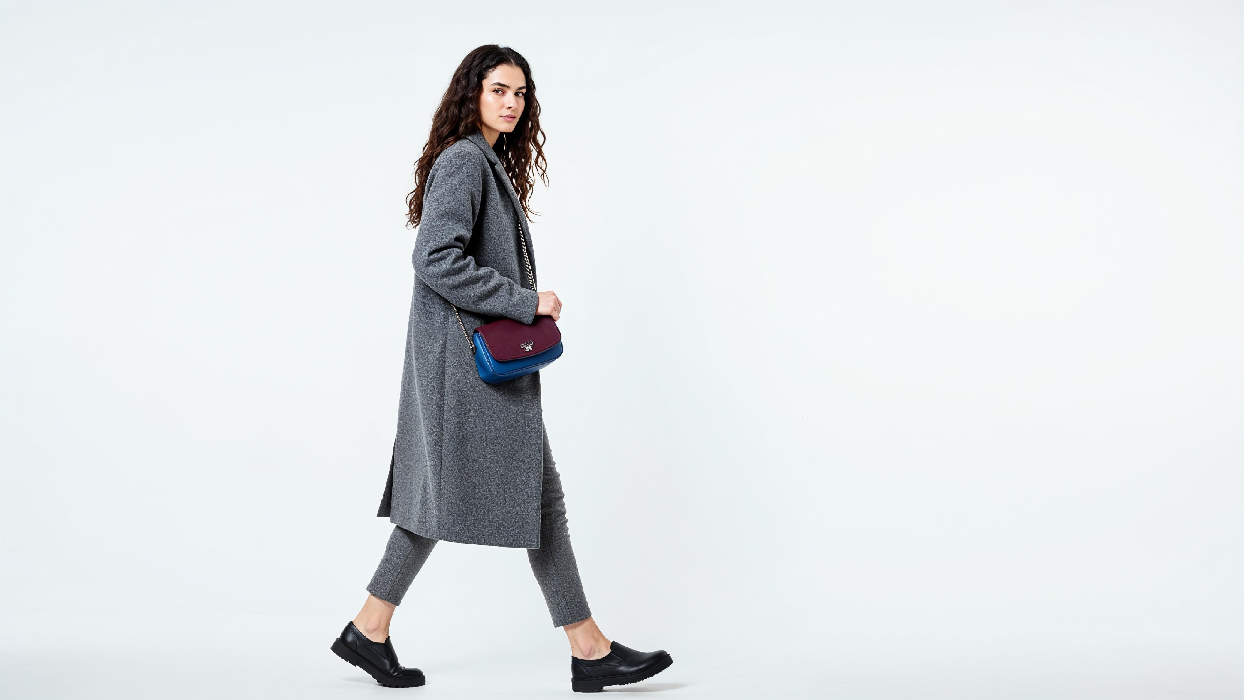 Fashionable Woman in Gray Coat and Trousers with Crossbody Bag