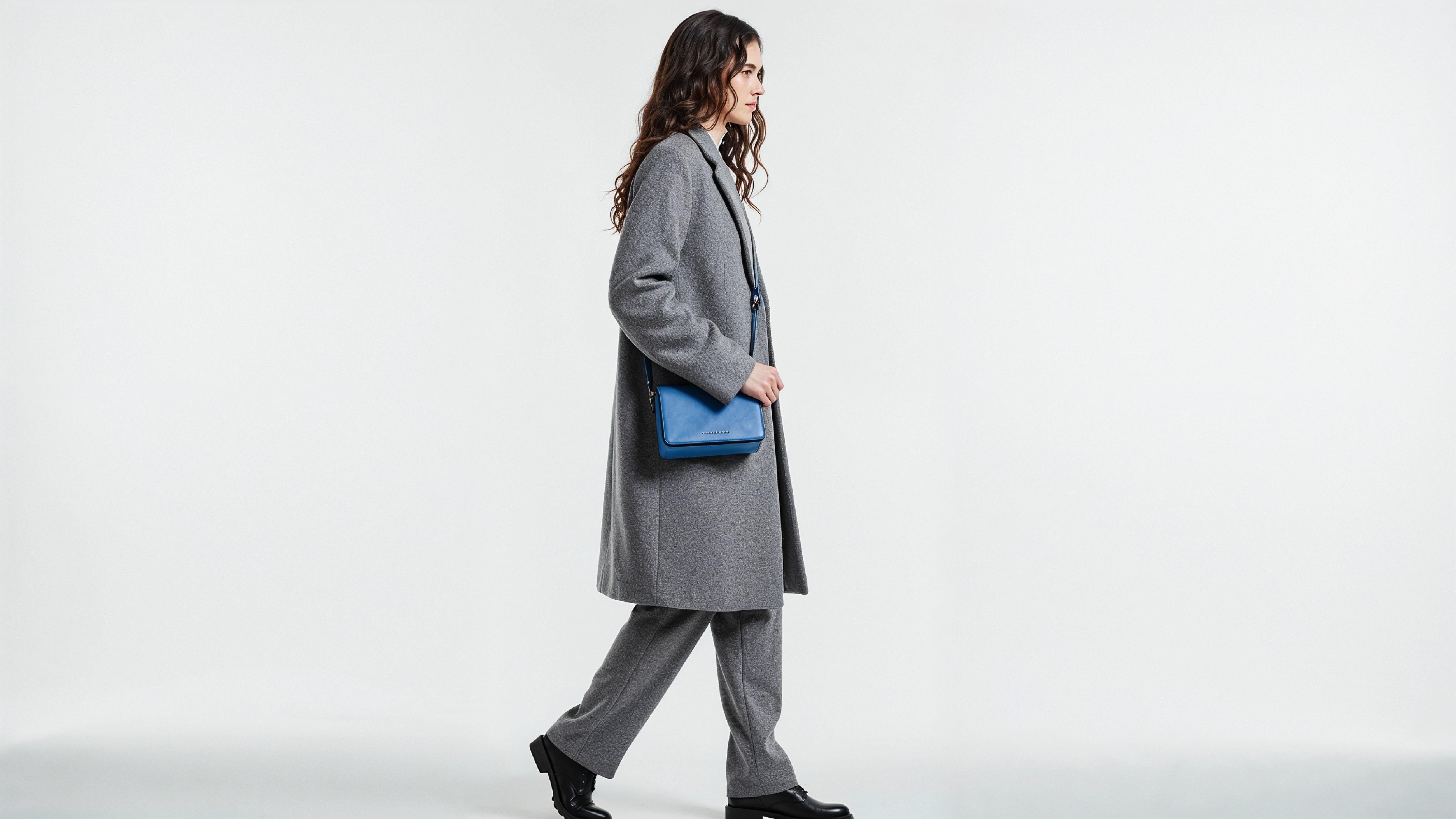 Fashionable Woman in Gray Coat and Trousers with Crossbody Bag