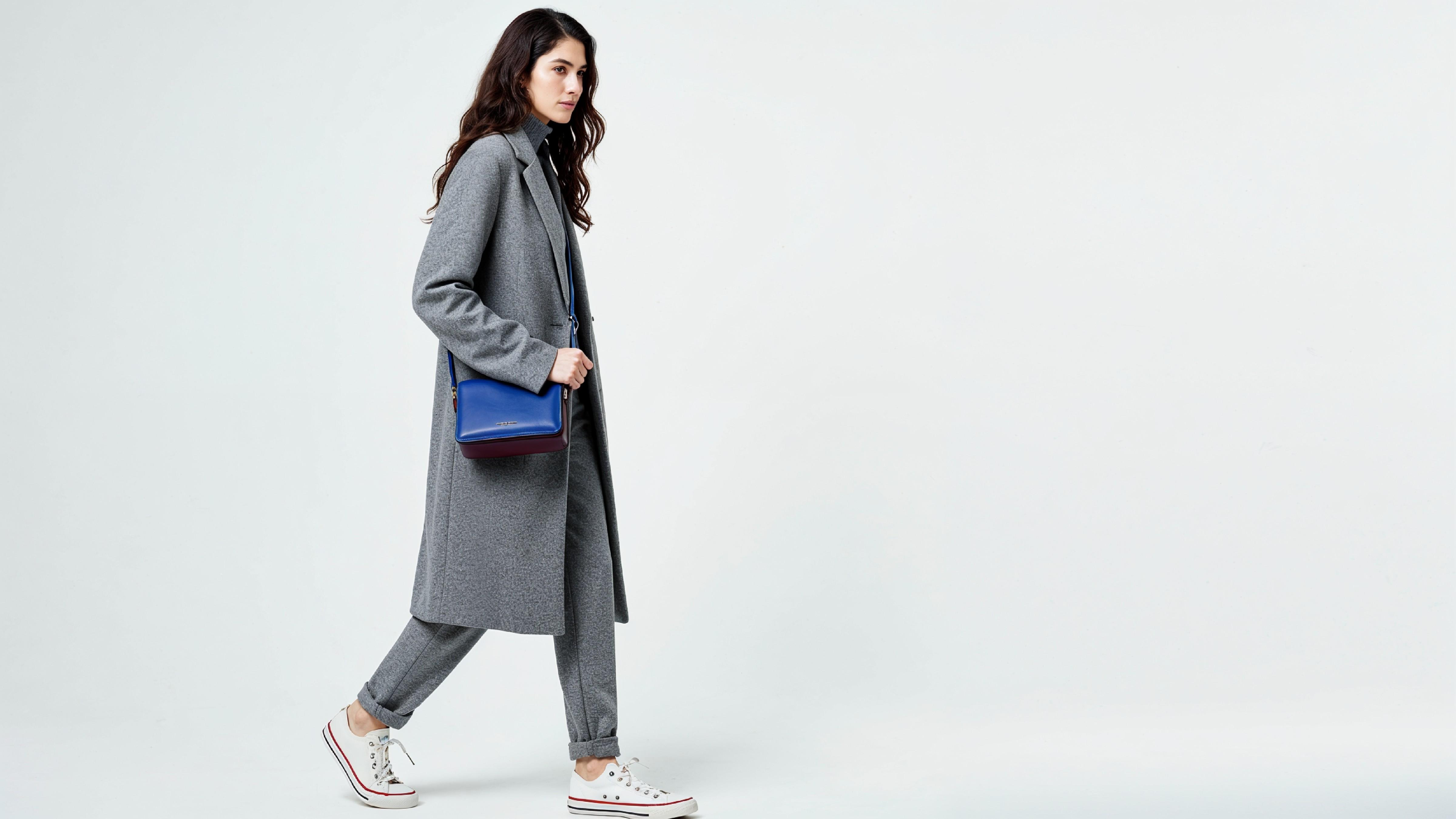 Fashionable Woman in Gray Coat and Trousers with Crossbody Bag
