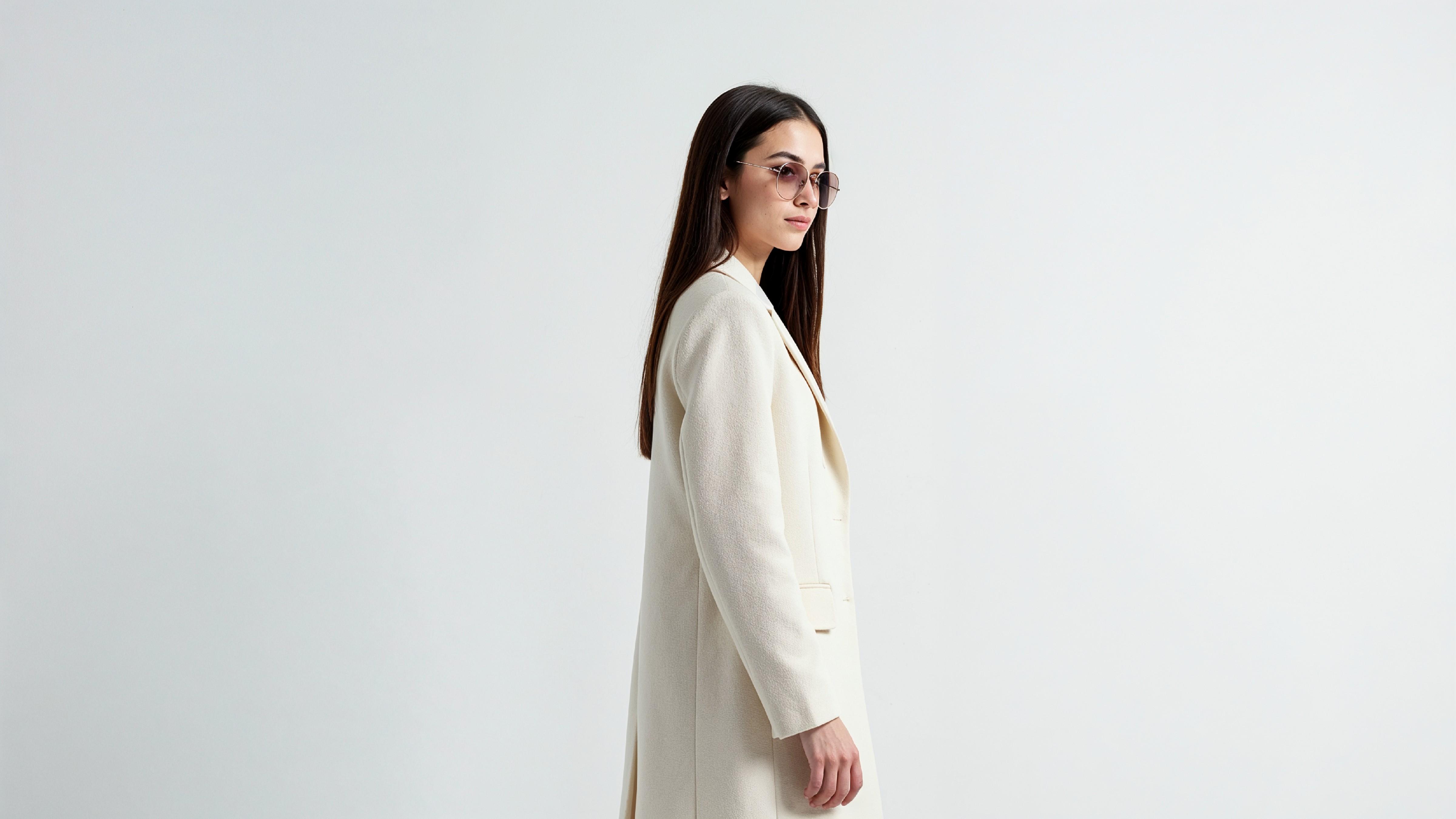 Stylish Young Woman Wearing Elegant Coat and Modern Fashion Outfit