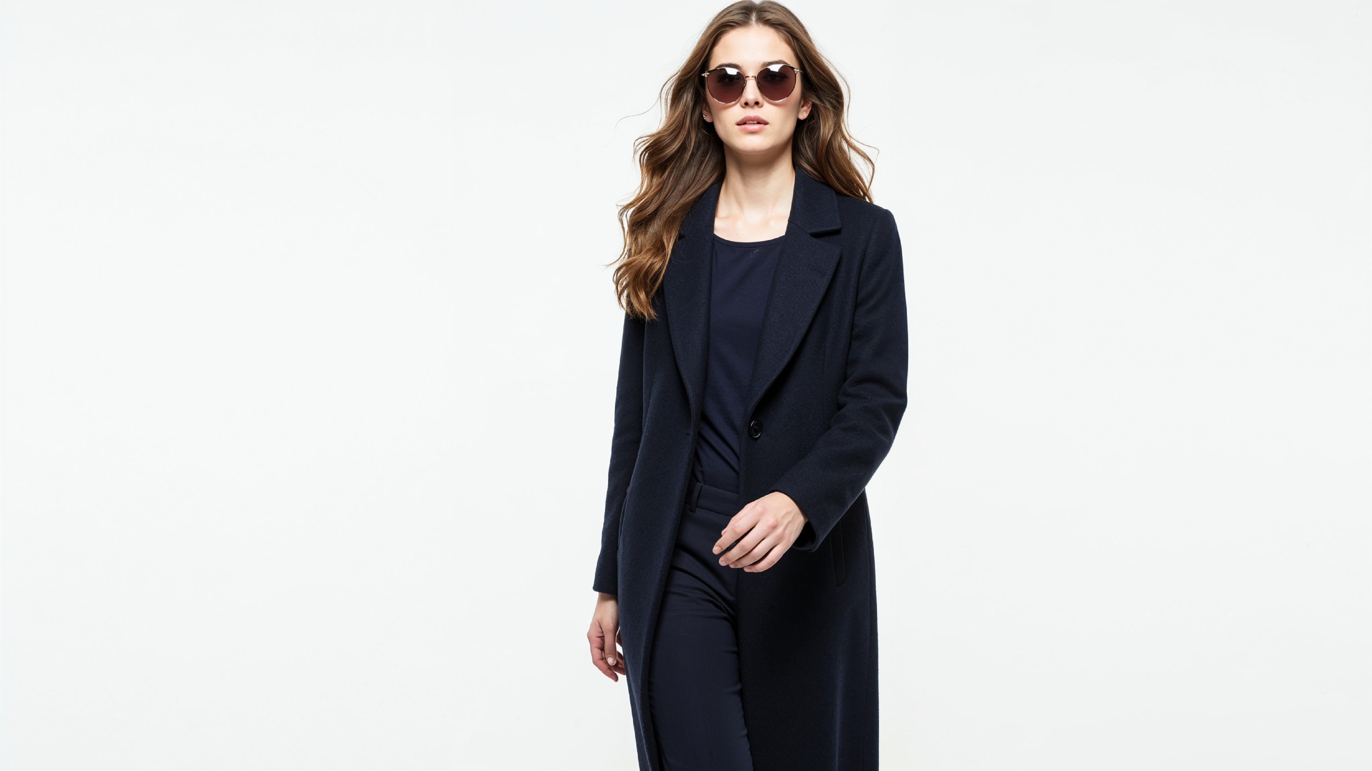 Stylish Young Woman Wearing Elegant Coat and Modern Fashion Outfit