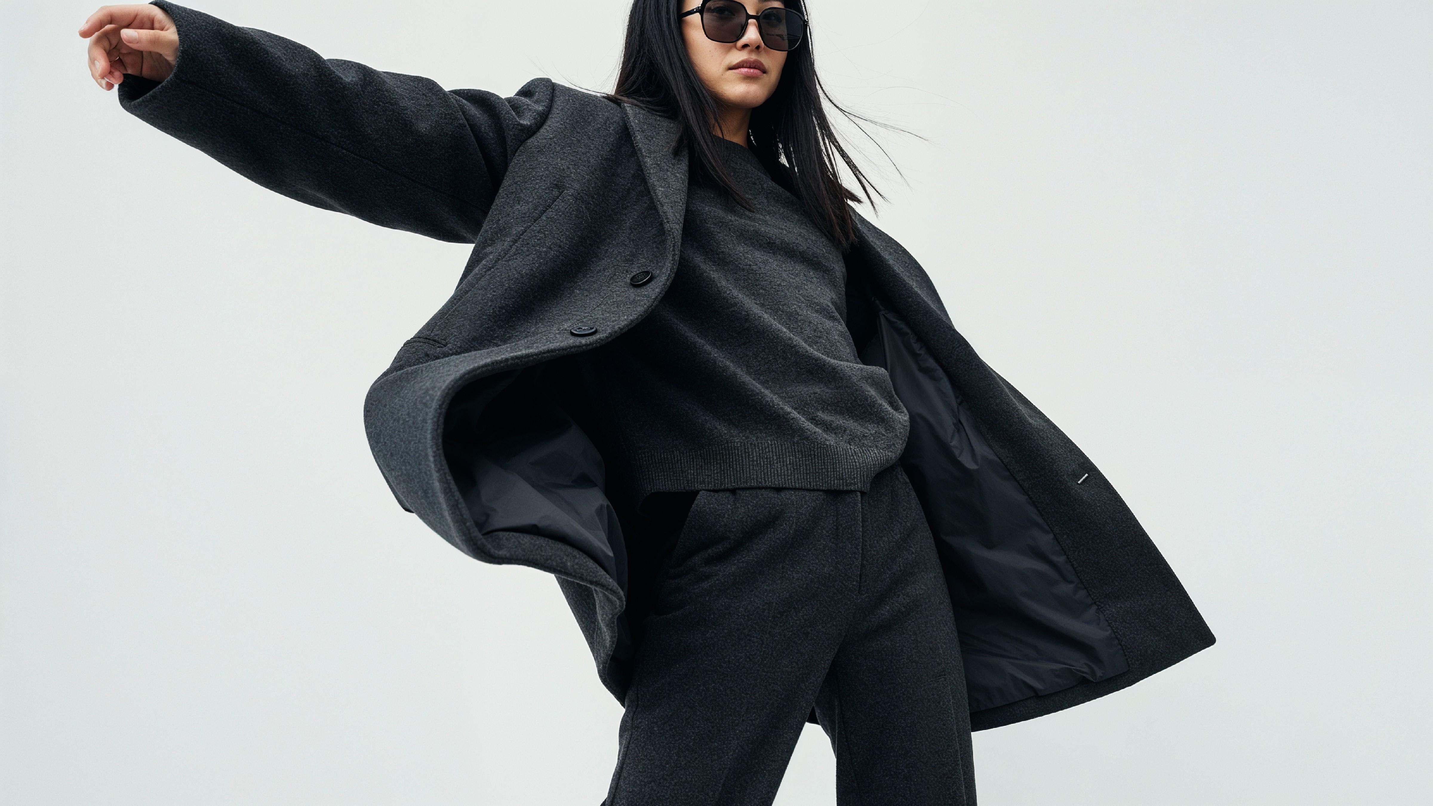 Stylish Young Woman Wearing Elegant Coat and Modern Fashion Outfit