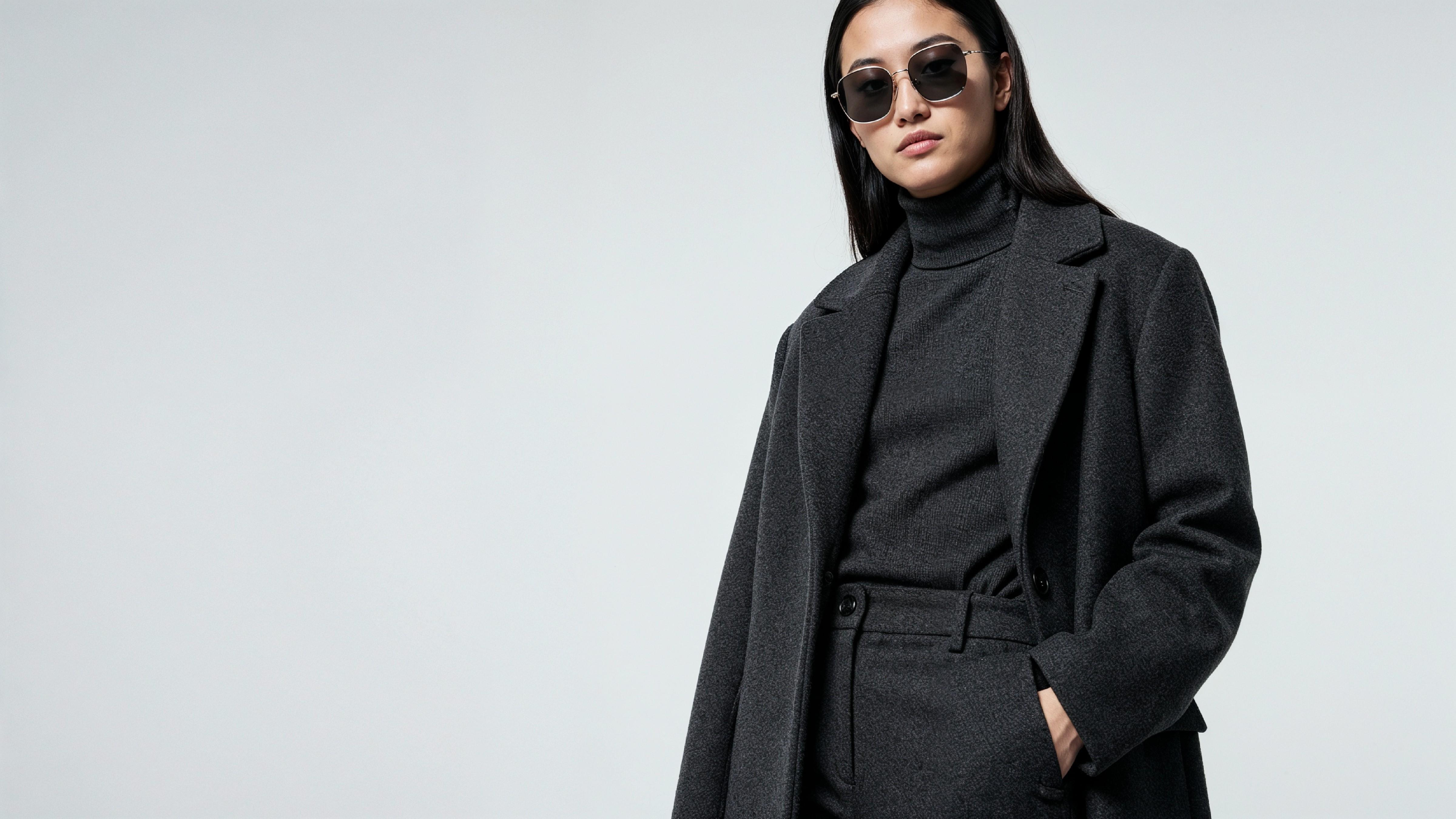 Stylish Young Woman Wearing Elegant Coat and Modern Fashion Outfit