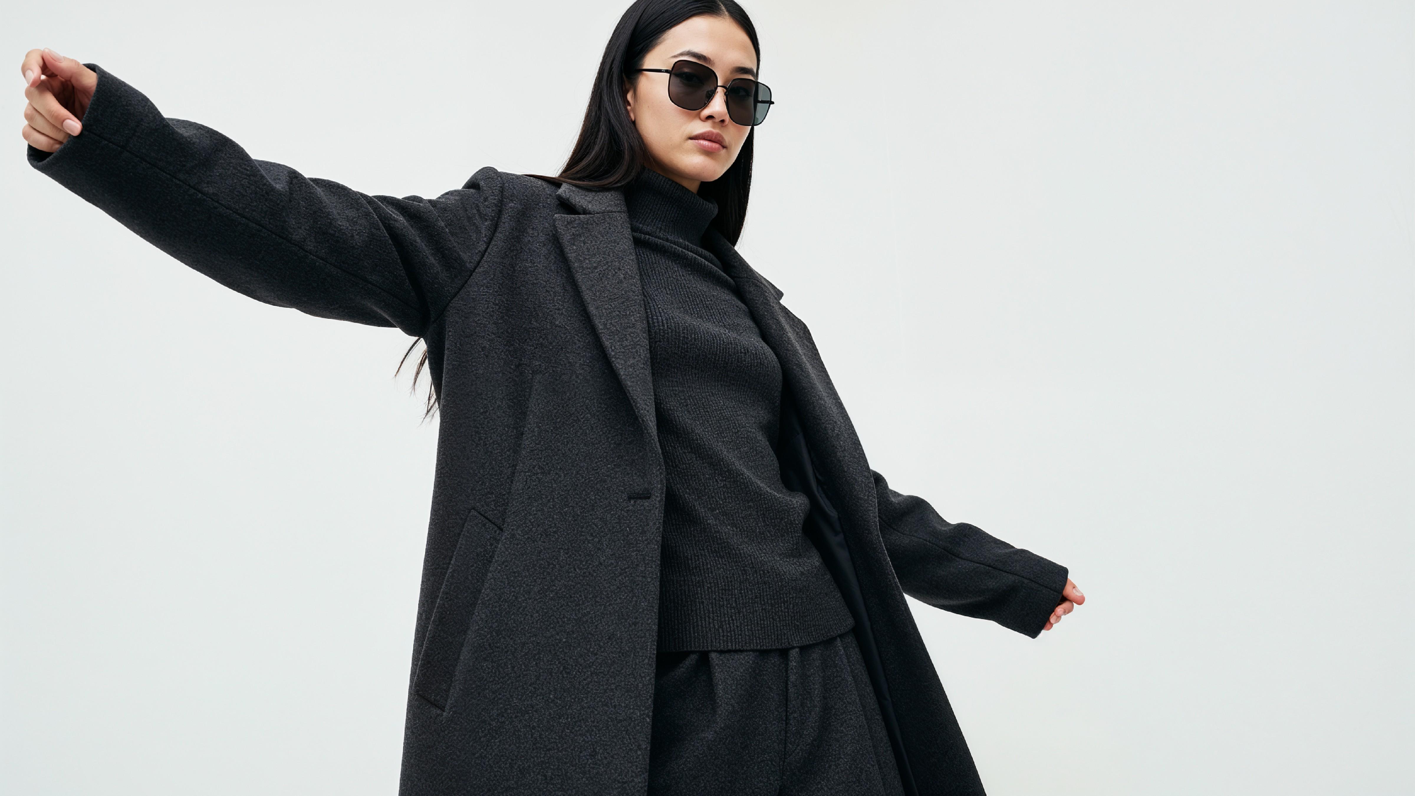 Stylish Young Woman Wearing Elegant Coat and Modern Fashion Outfit